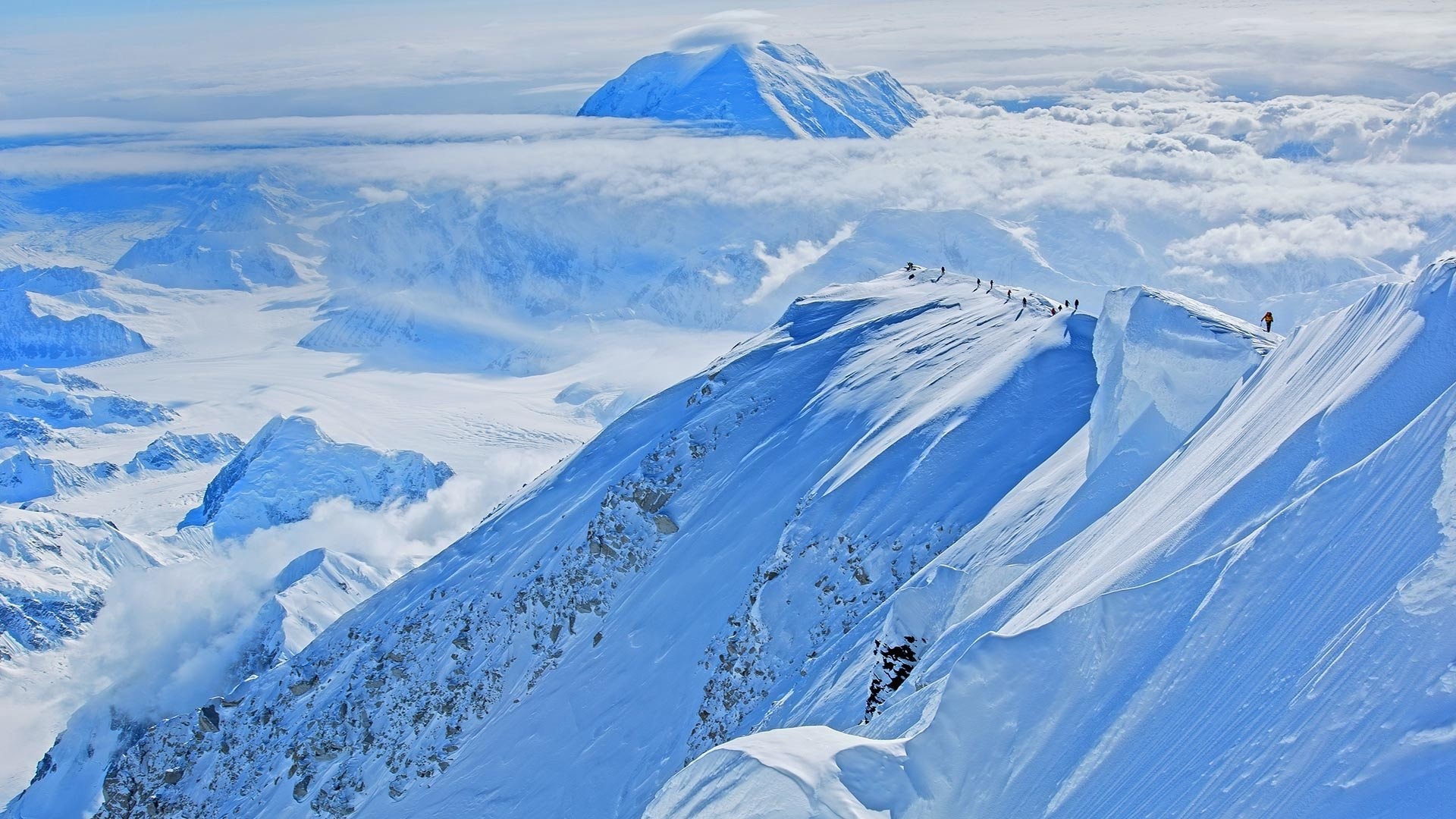 Denali Summit with Climbers and Clouds HD Wallpaper