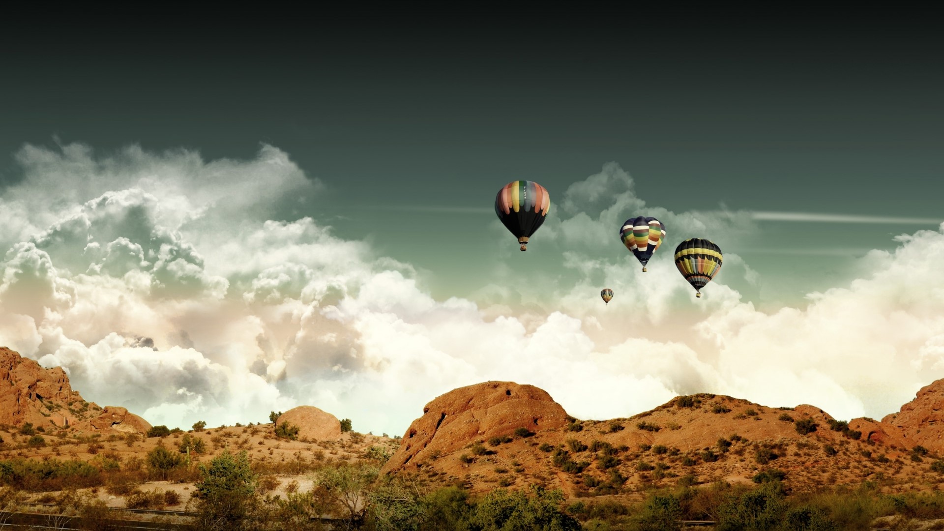 Hot air balloons over desert mountains HD Wallpaper