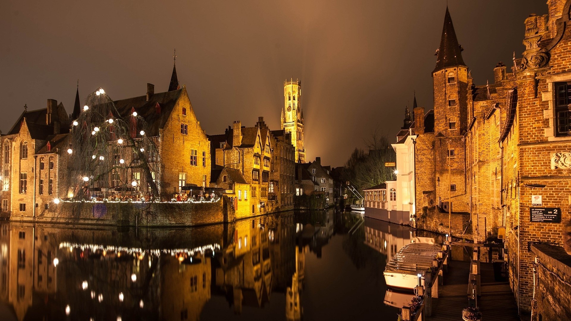 Bruges at night with canal and buildings HD Wallpaper