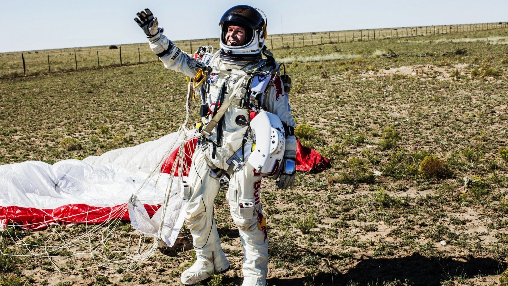 Felix Baumgartner in Red Bull Stratos suit with parachute HD Wallpaper