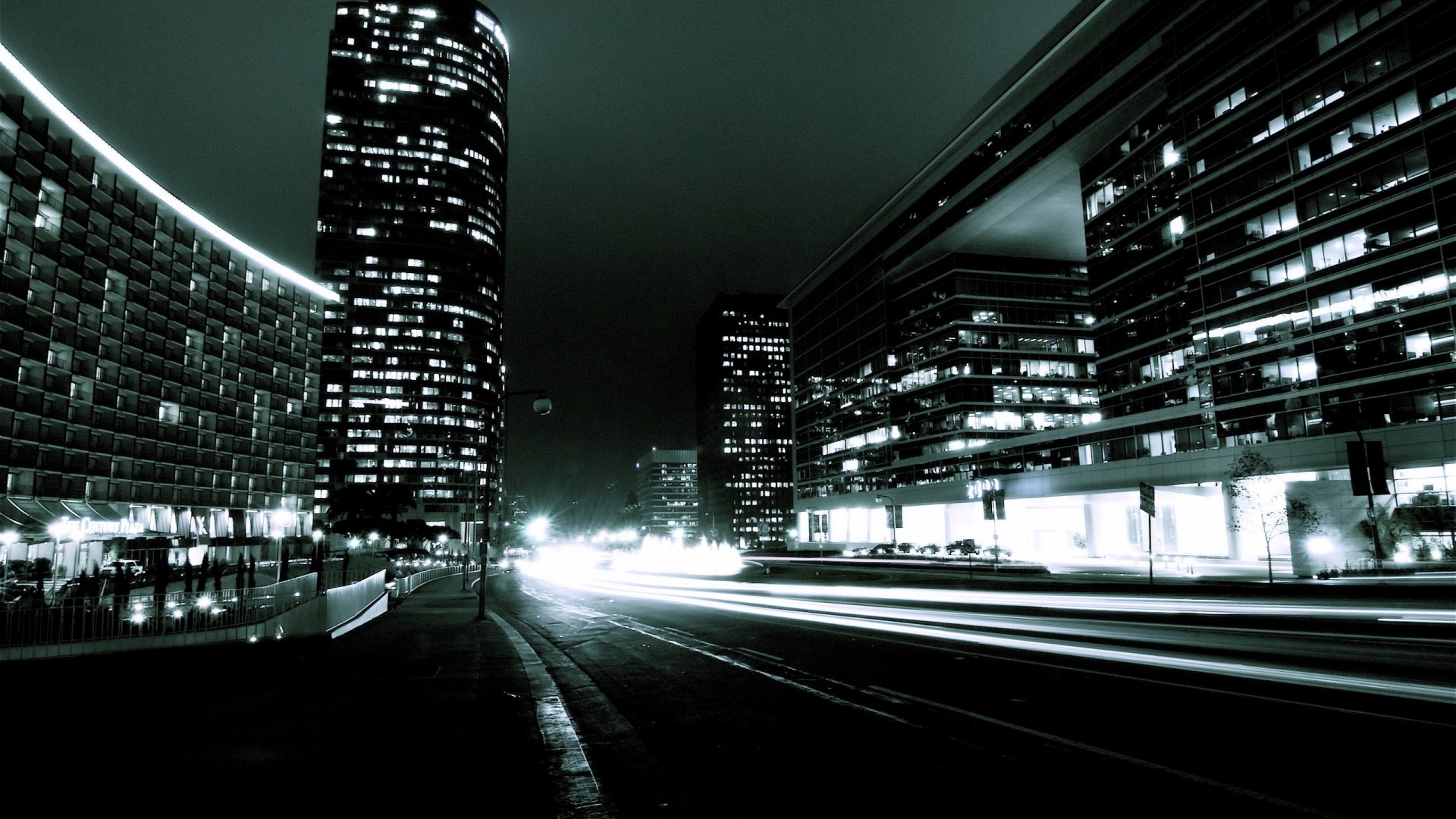 Dark Cityscape at Night with Light Trails HD Wallpaper