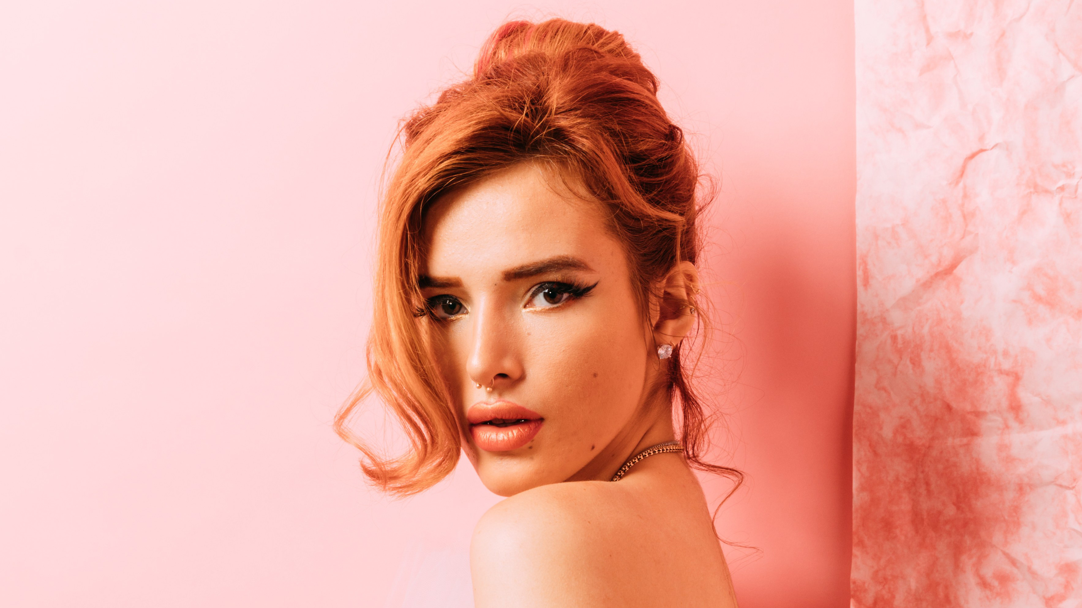 Bella Thorne posing against a pink background HD Wallpaper