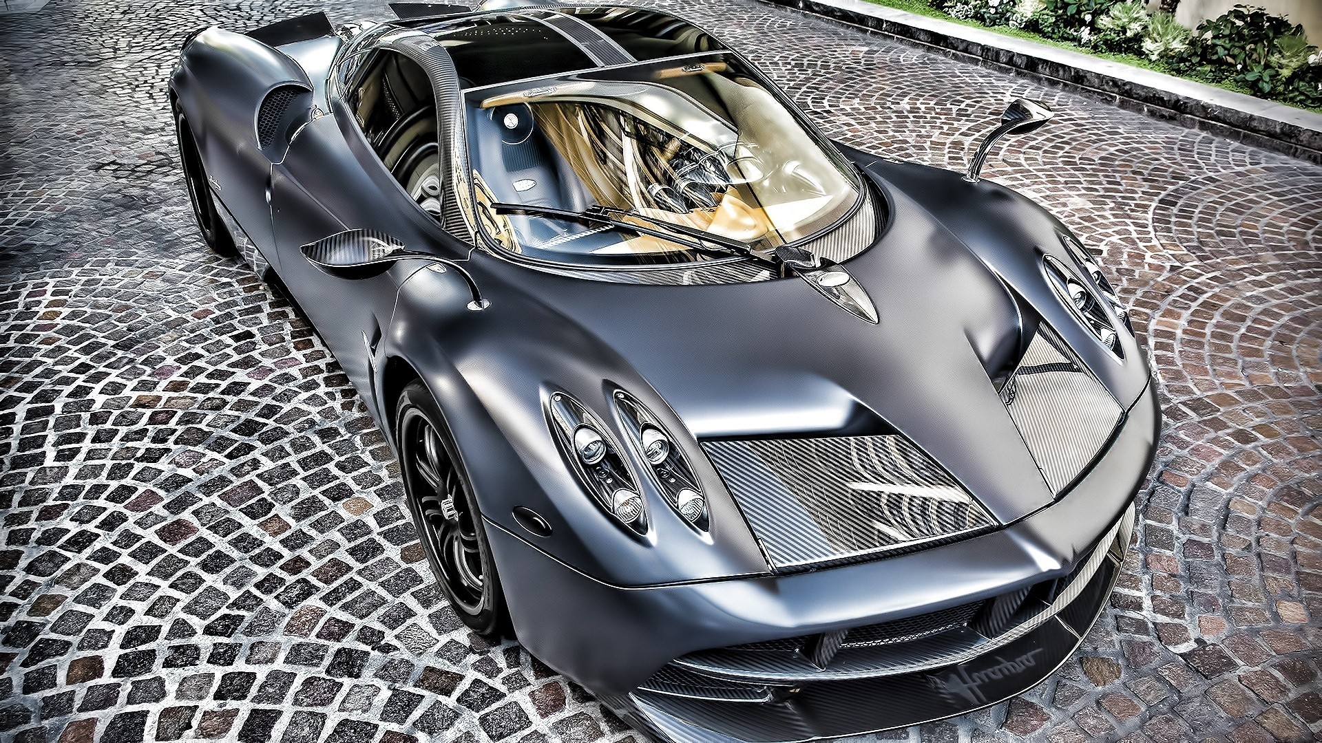 Matte gray Pagani Huayra on cobblestone street HD Wallpaper