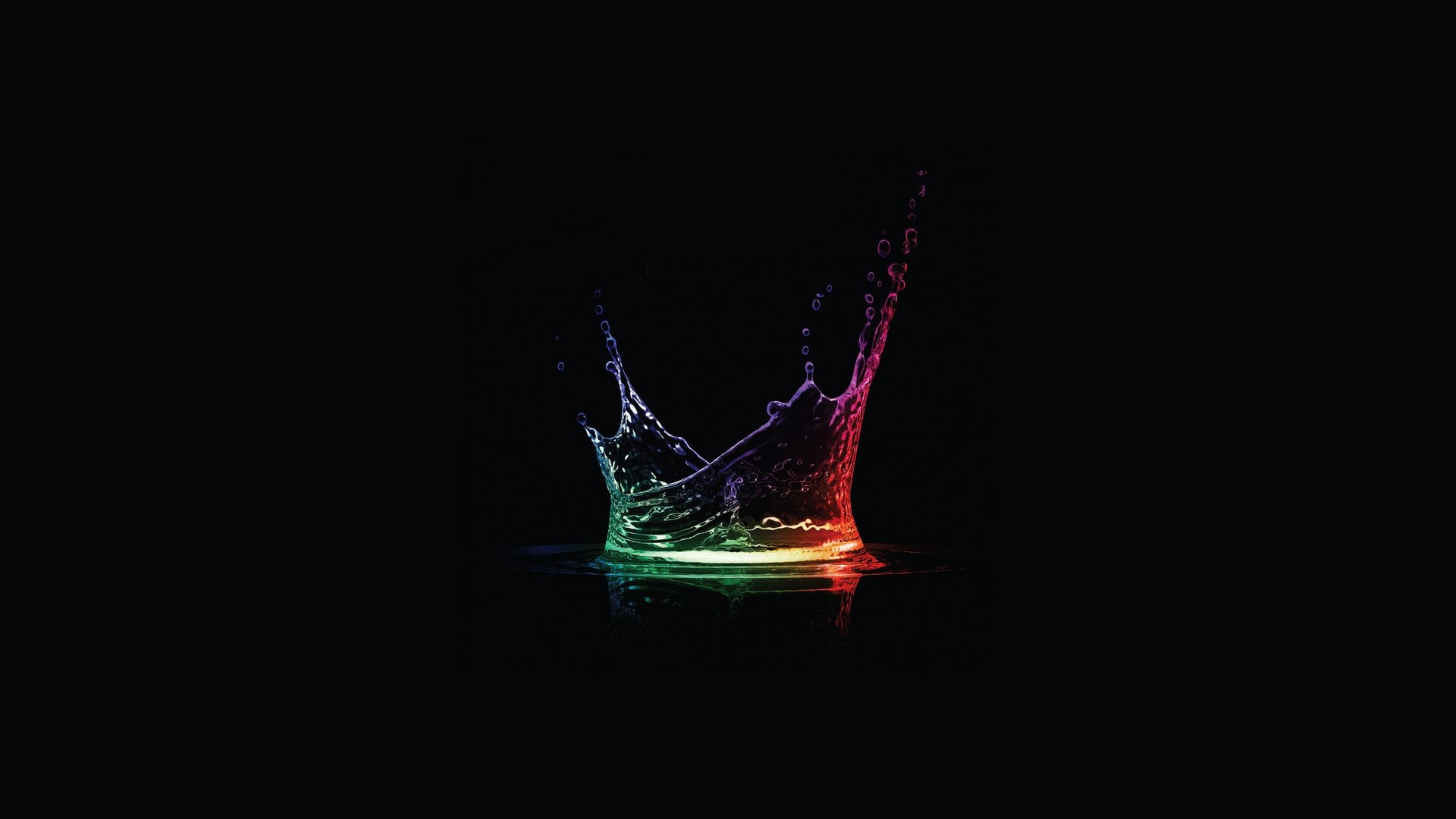Colorful water splash on black background HD Wallpaper