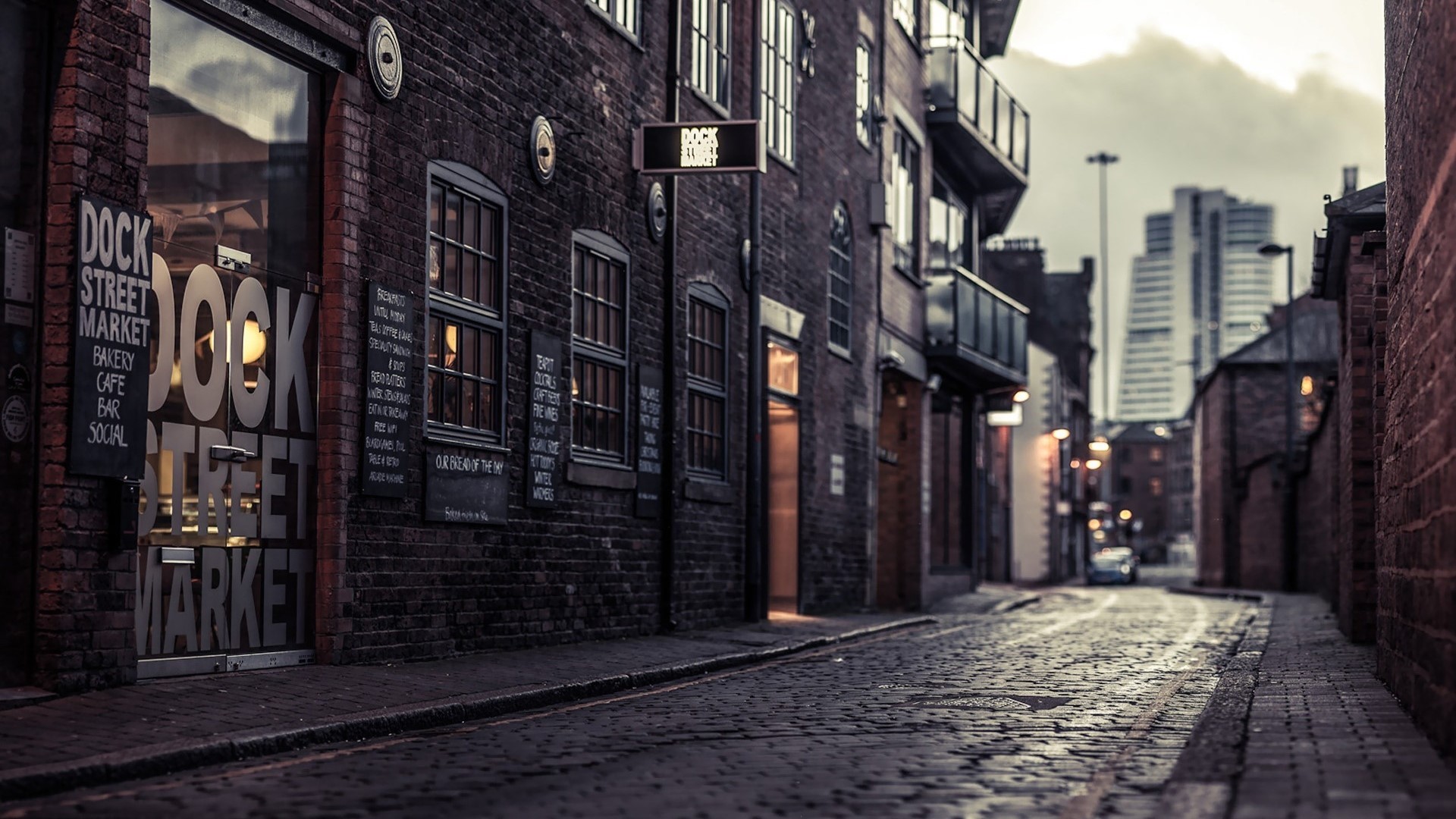 Dock Street Market building on a cobblestone street HD Wallpaper