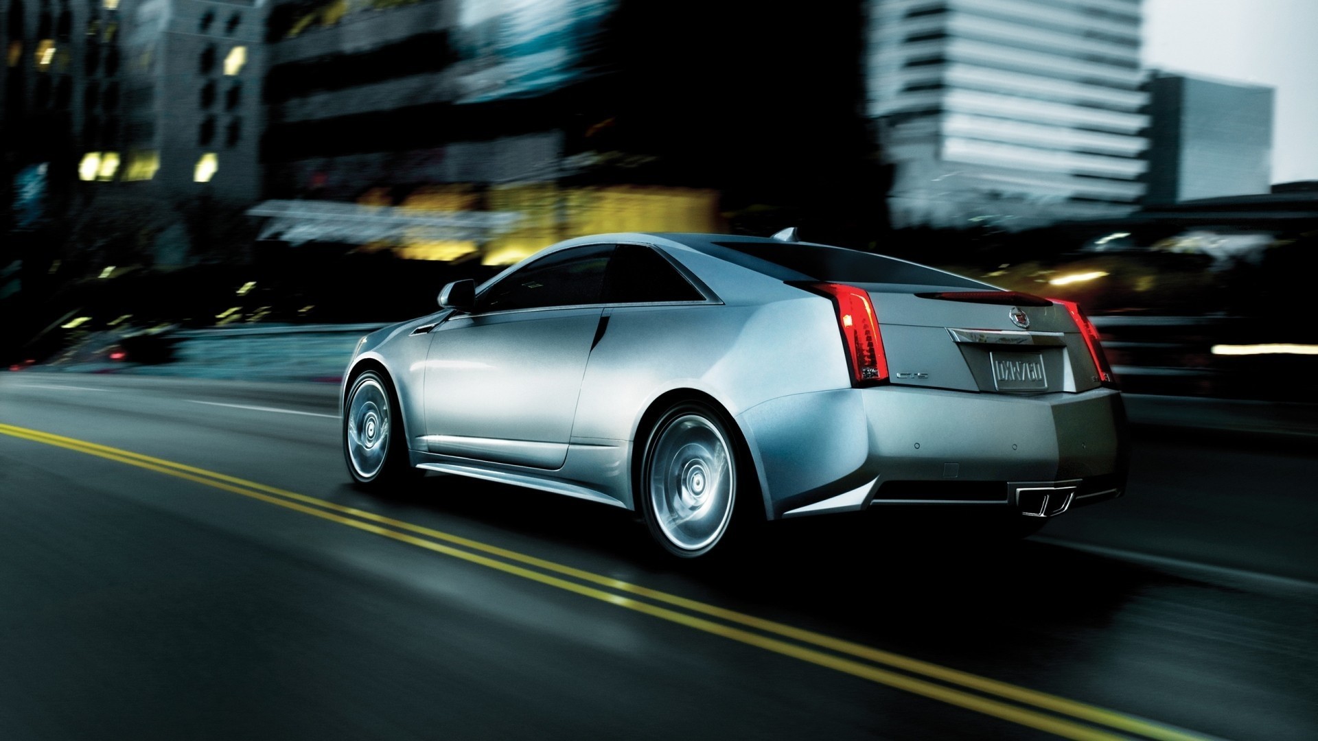 2013 Cadillac CTS Coupe driving at night HD Wallpaper