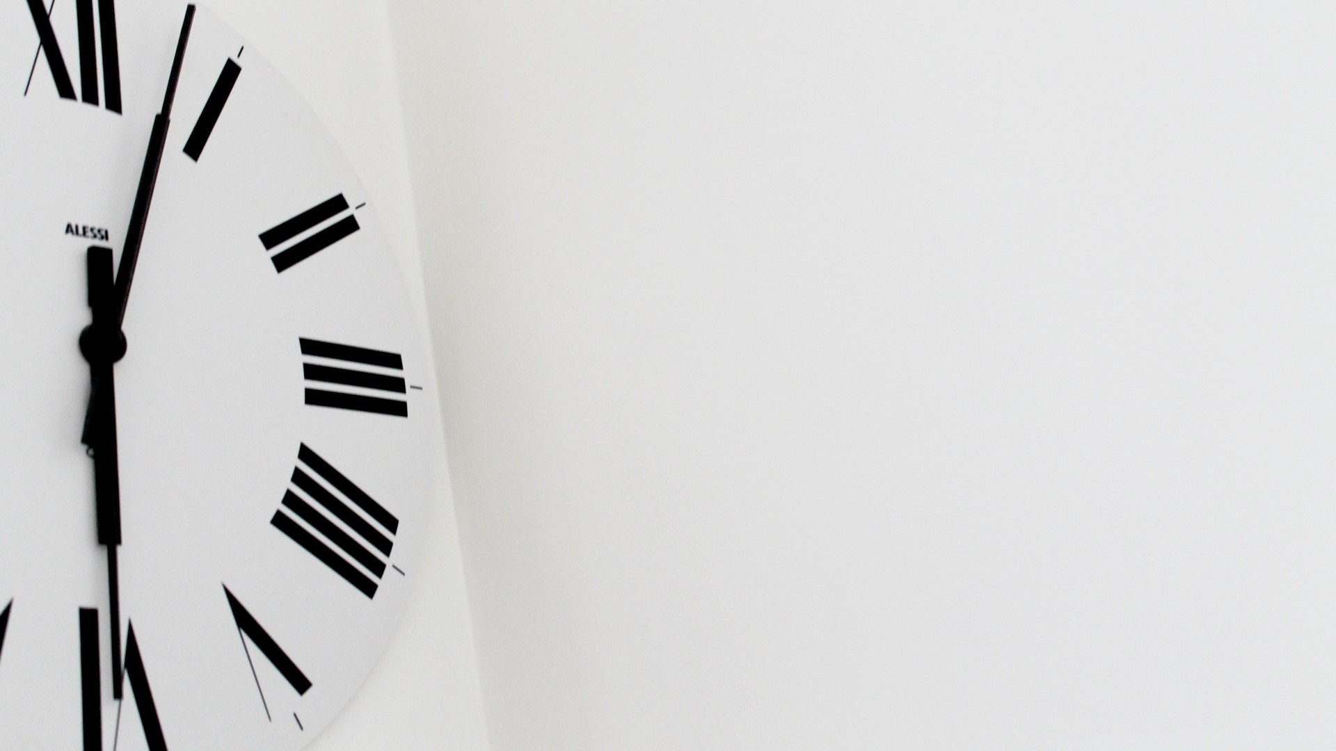 Alessi clock with Roman numerals HD Wallpaper