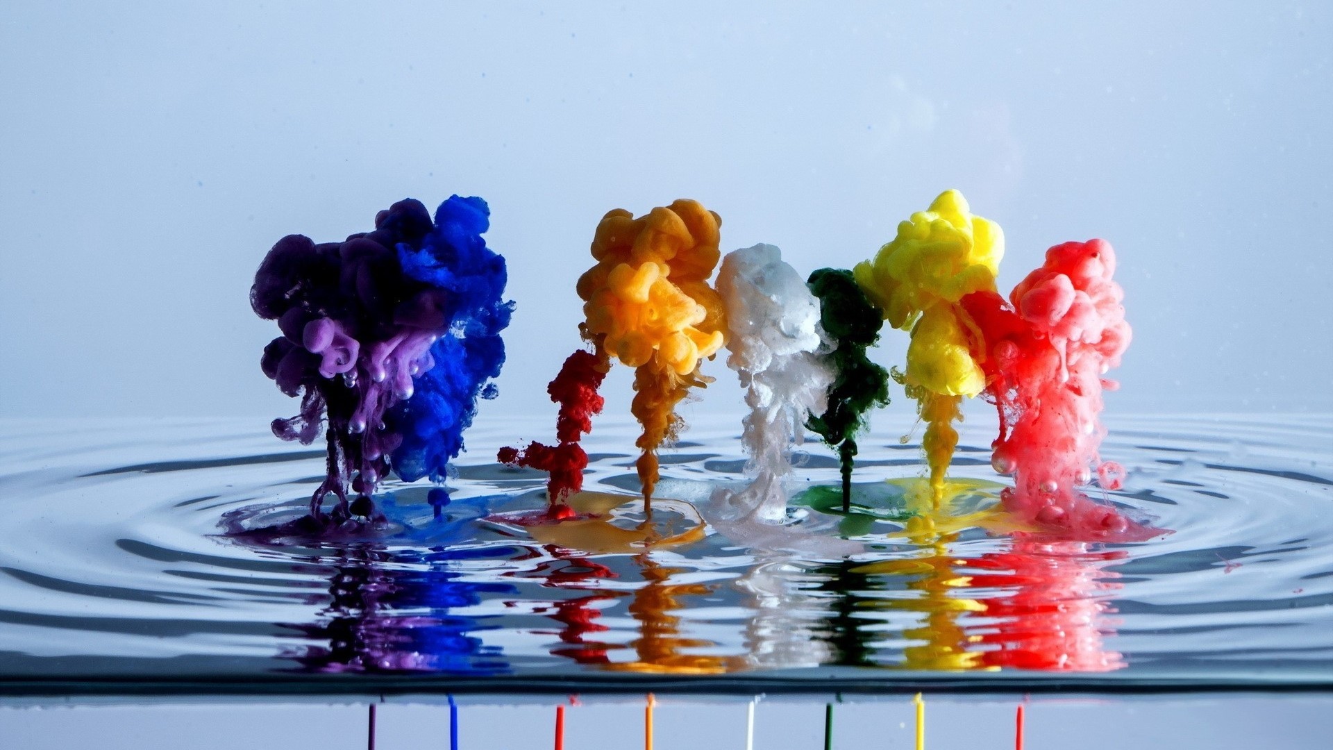 Colorful ink clouds erupting in water HD Wallpaper