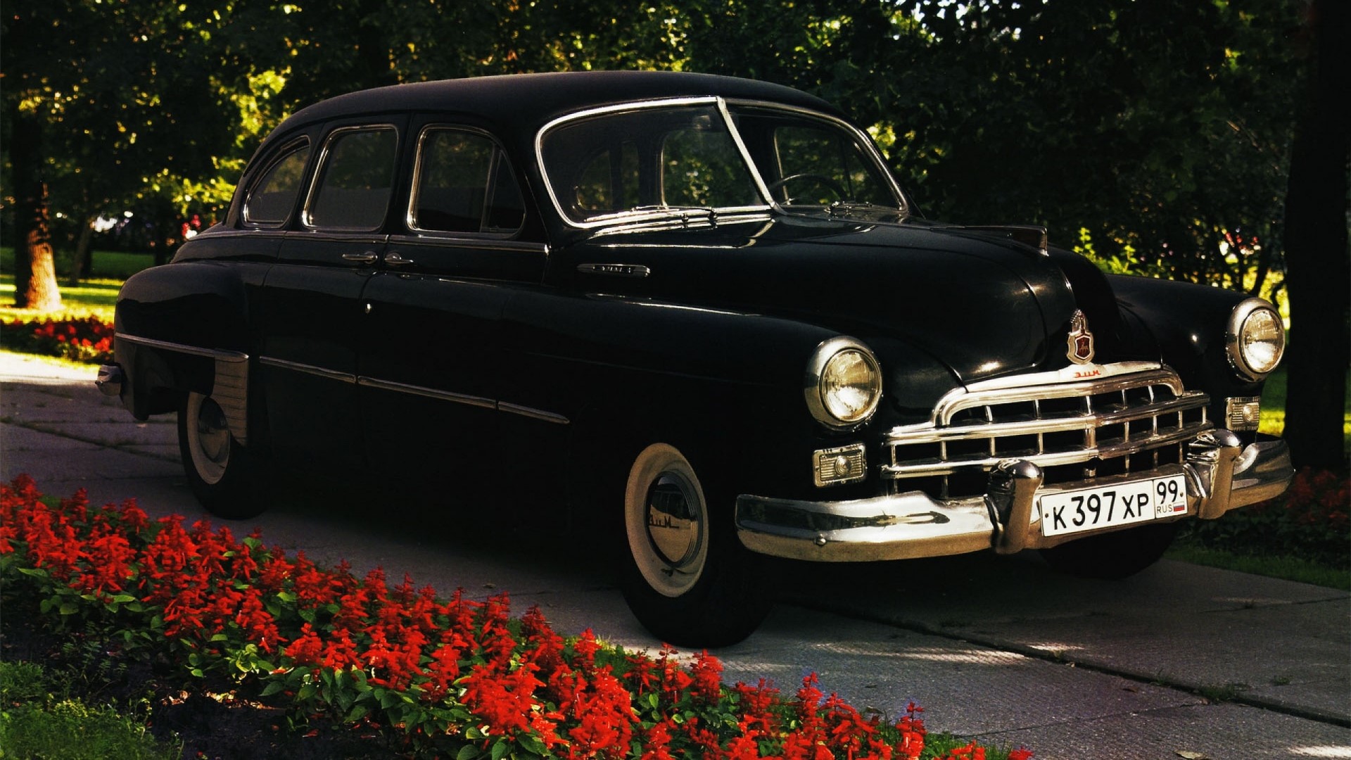 Black GAZ-21 Volga car with red flowers HD Wallpaper