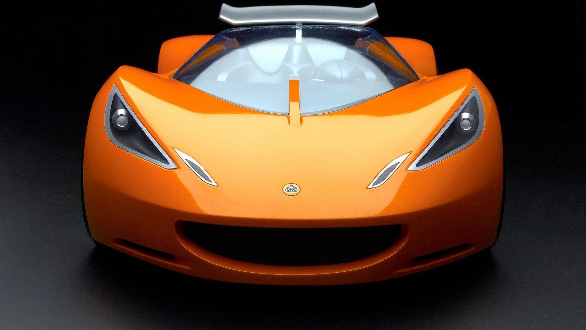 Orange Lotus sports car front view HD Wallpaper