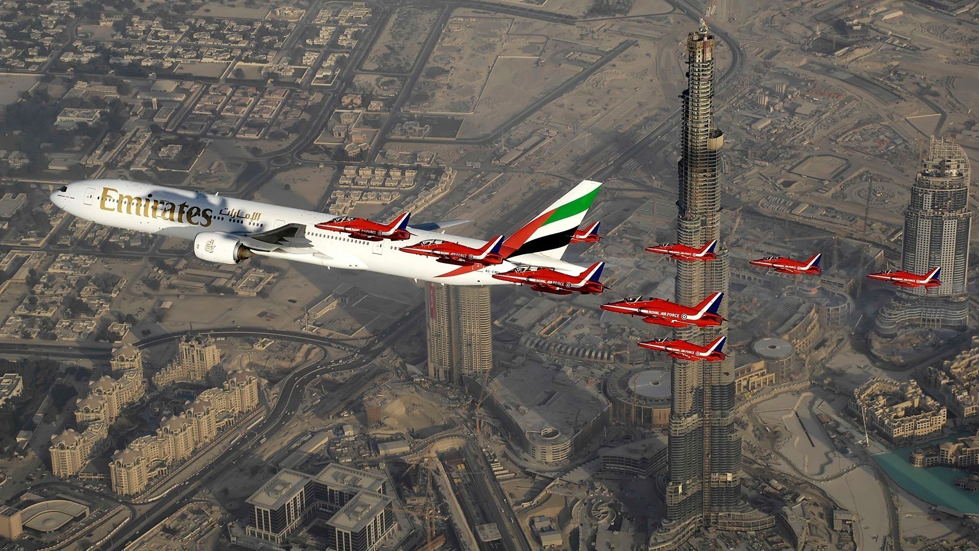 Emirates airplane flying with Red Arrows over Dubai HD Wallpaper
