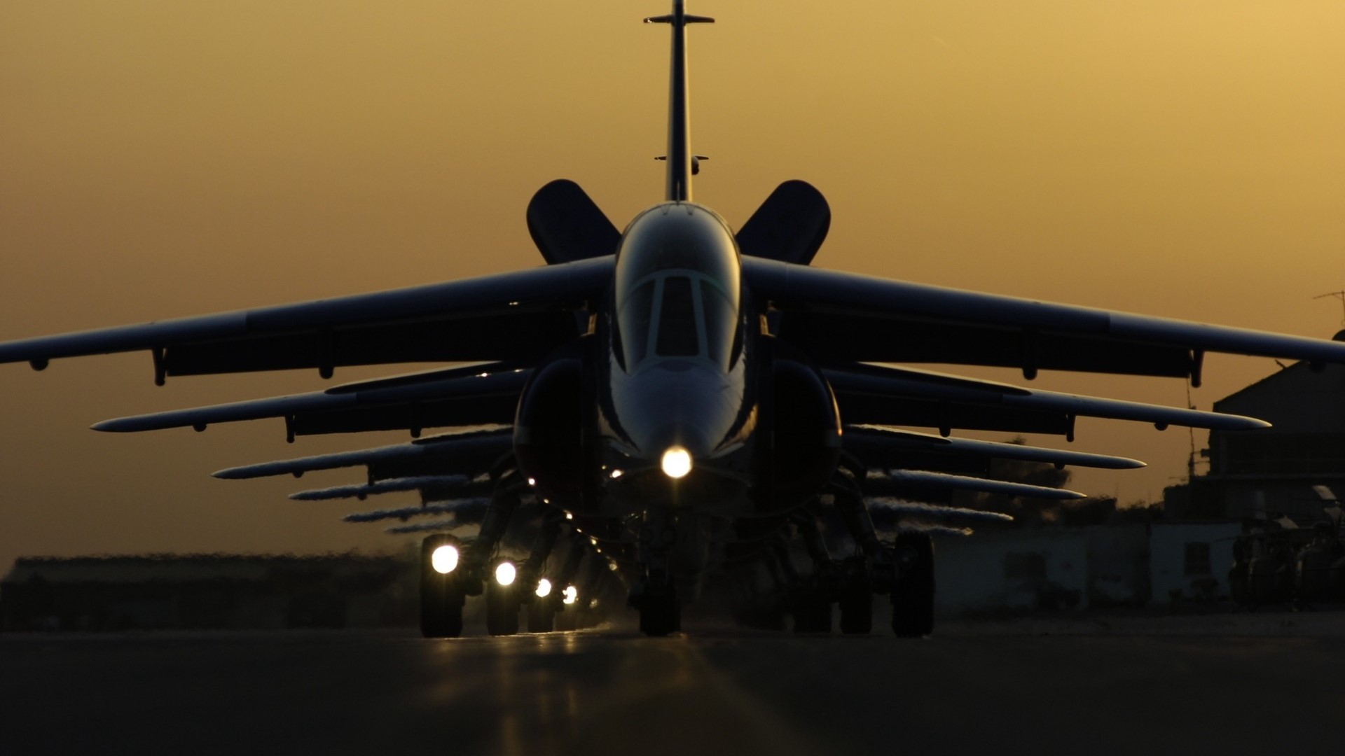 Fighter jets lined up on a runway at sunset HD Wallpaper