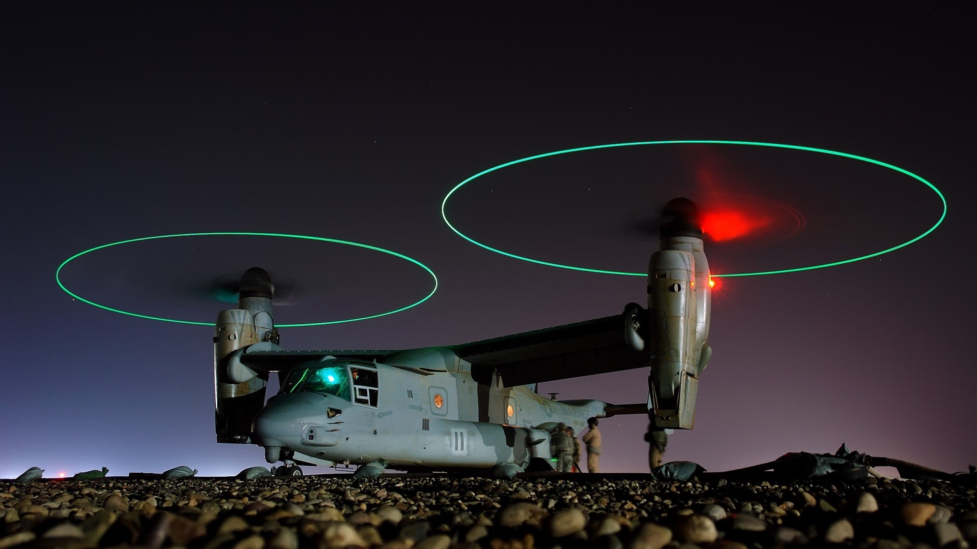 Osprey aircraft with glowing rotors at night HD Wallpaper