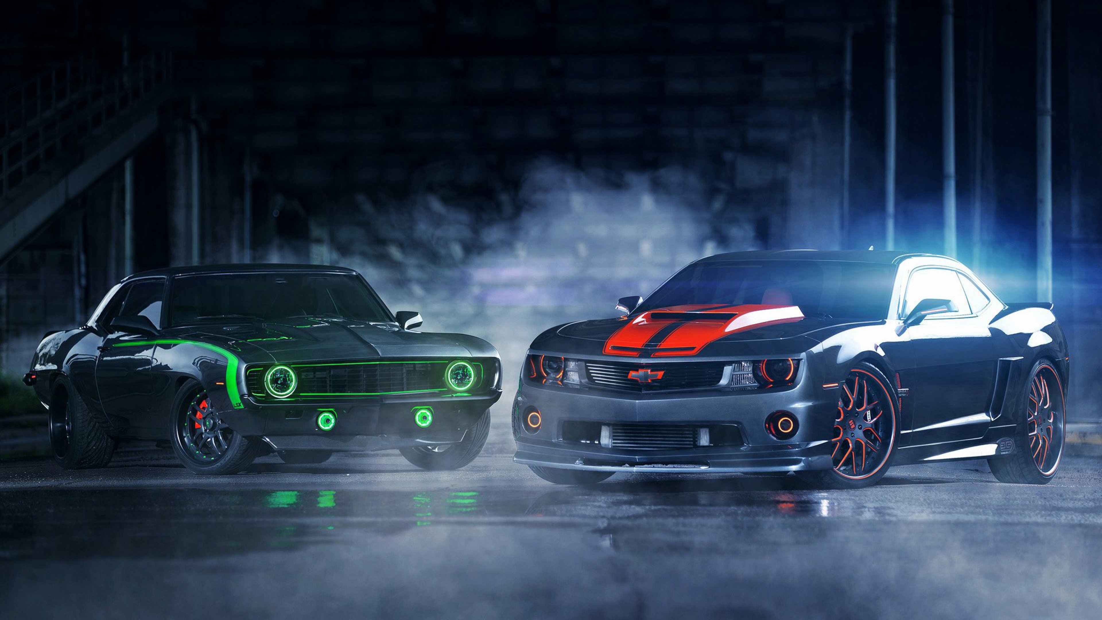Two Chevrolet Camaros, one classic and one modern HD Wallpaper