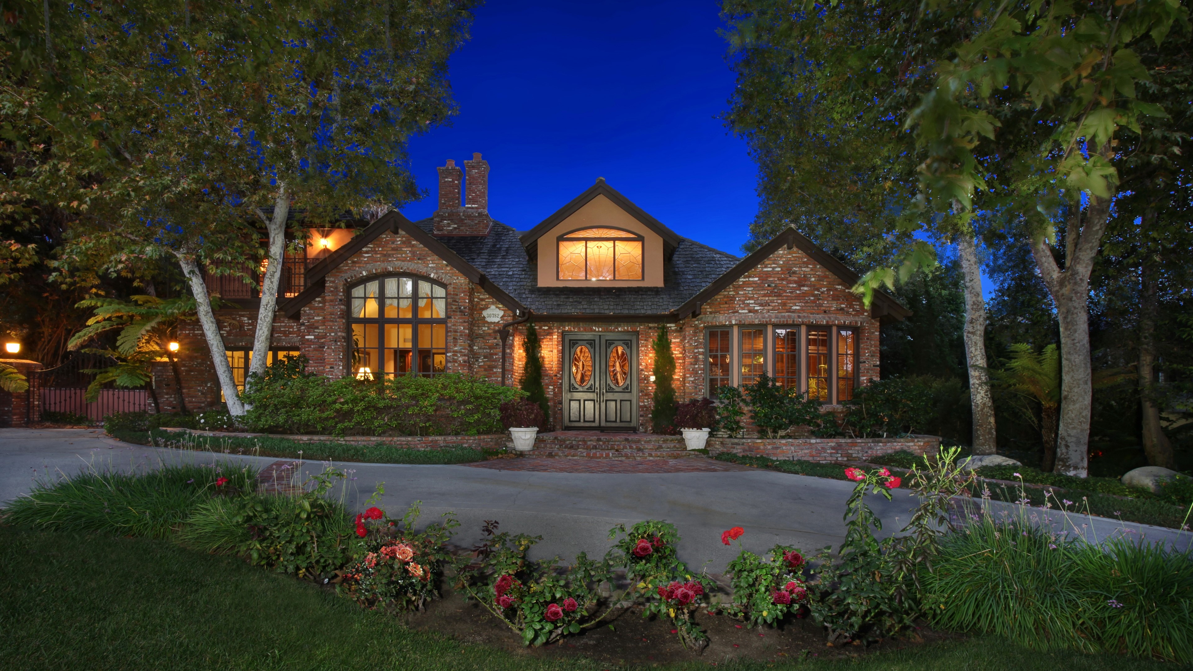 Brick Mansion with Double Doors at Dusk HD Wallpaper