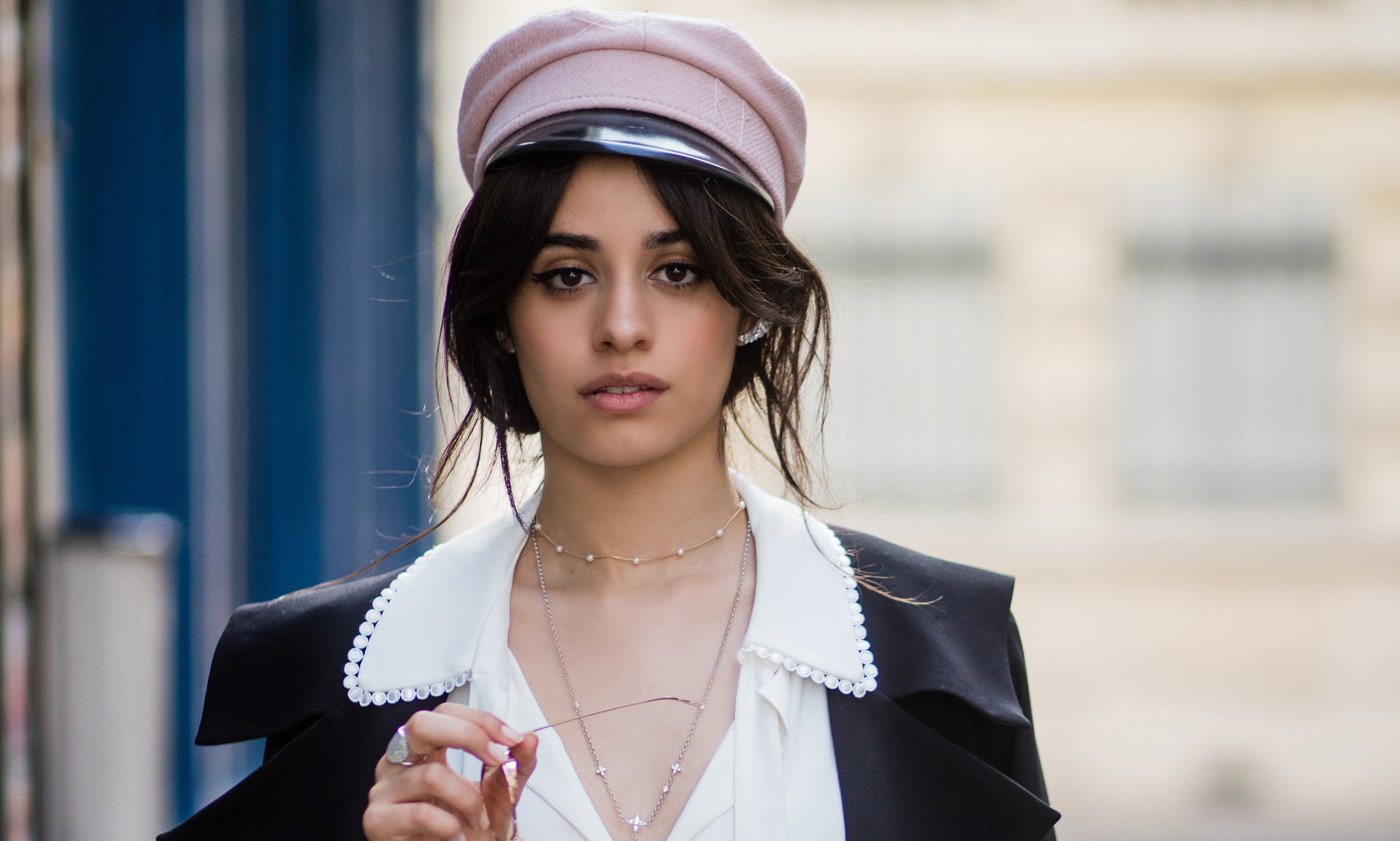 Camila Cabello wearing a pink cap and black jacket HD Wallpaper