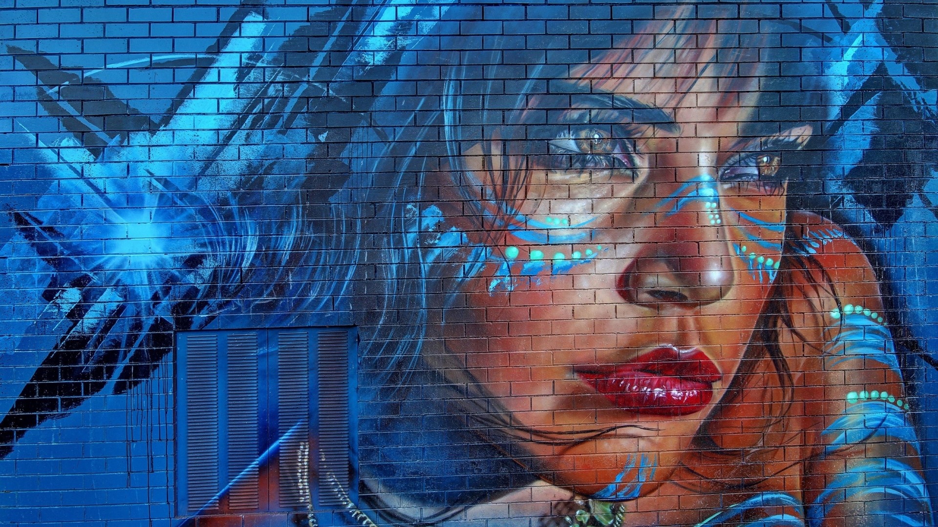 Graffiti of a woman with blue face paint HD Wallpaper