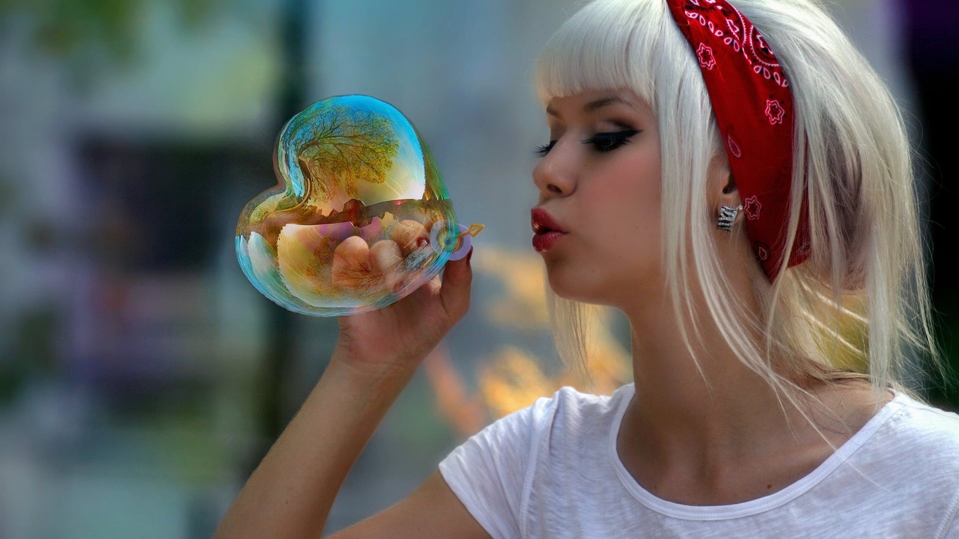 Girl blowing a heart-shaped bubble HD Wallpaper