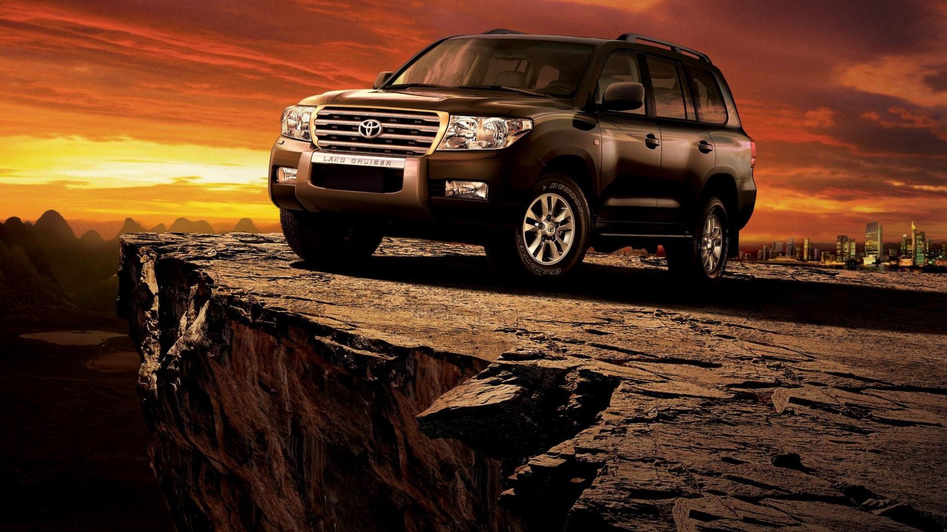 Toyota Land Cruiser on a cliff edge at sunset HD Wallpaper