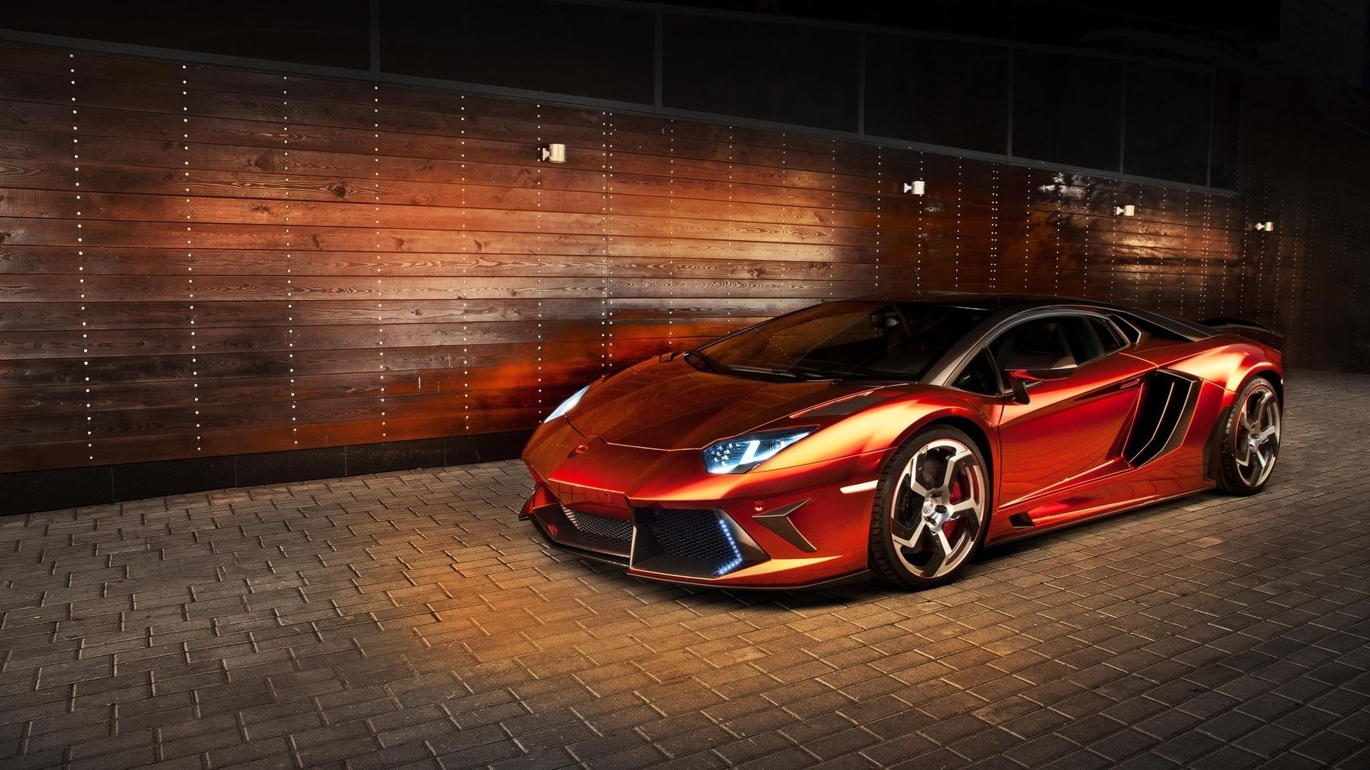 Red Lamborghini Aventador parked by a wooden wall HD Wallpaper