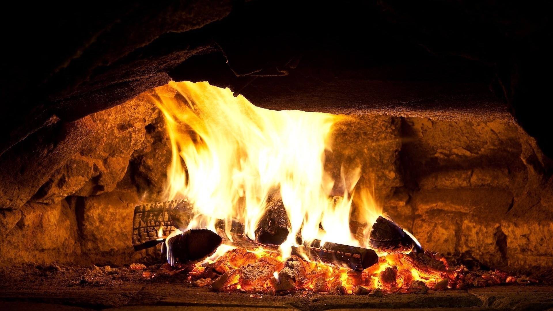 Fireplace with burning logs and embers HD Wallpaper