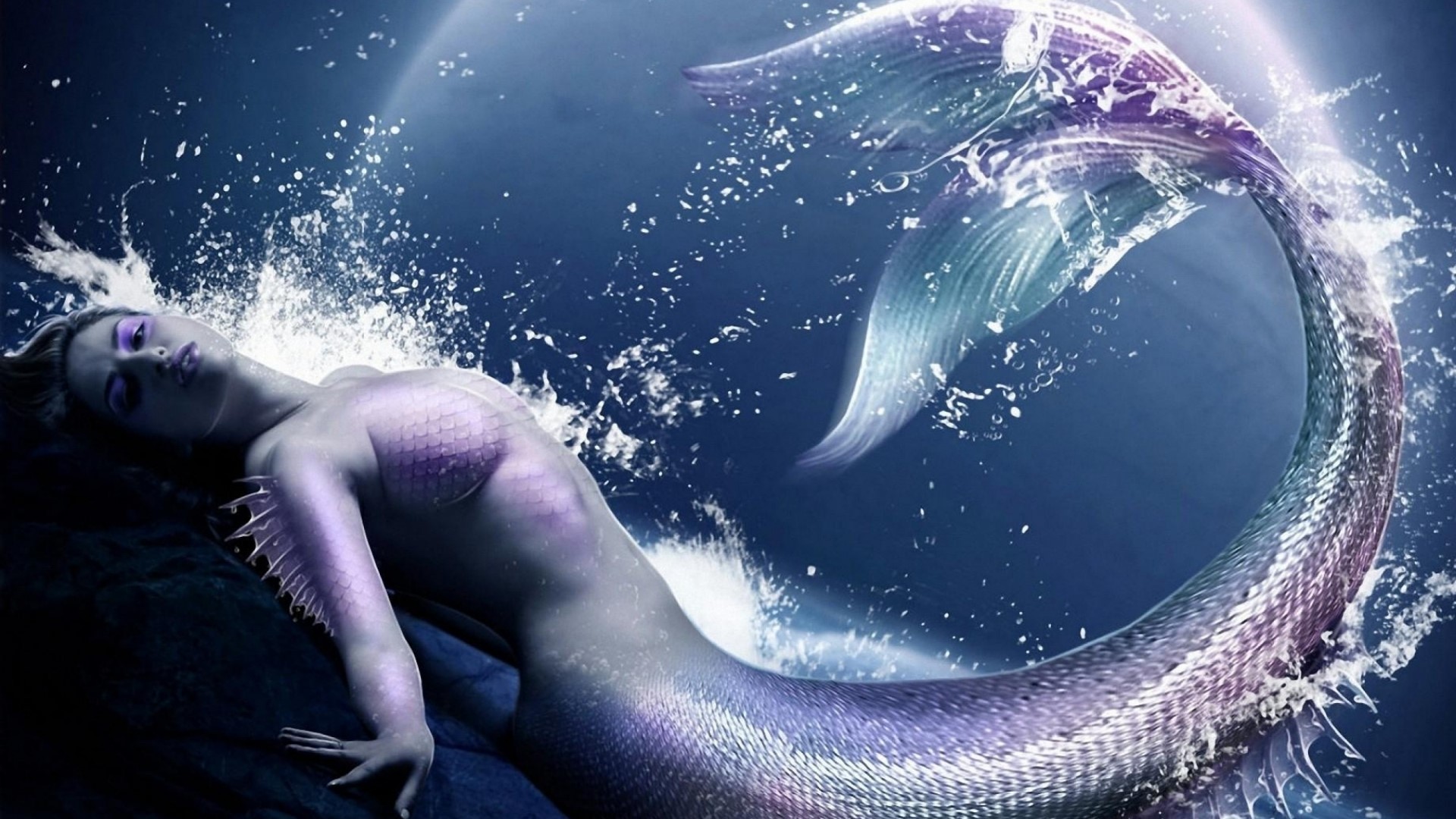Mermaid with shimmering tail in water HD Wallpaper
