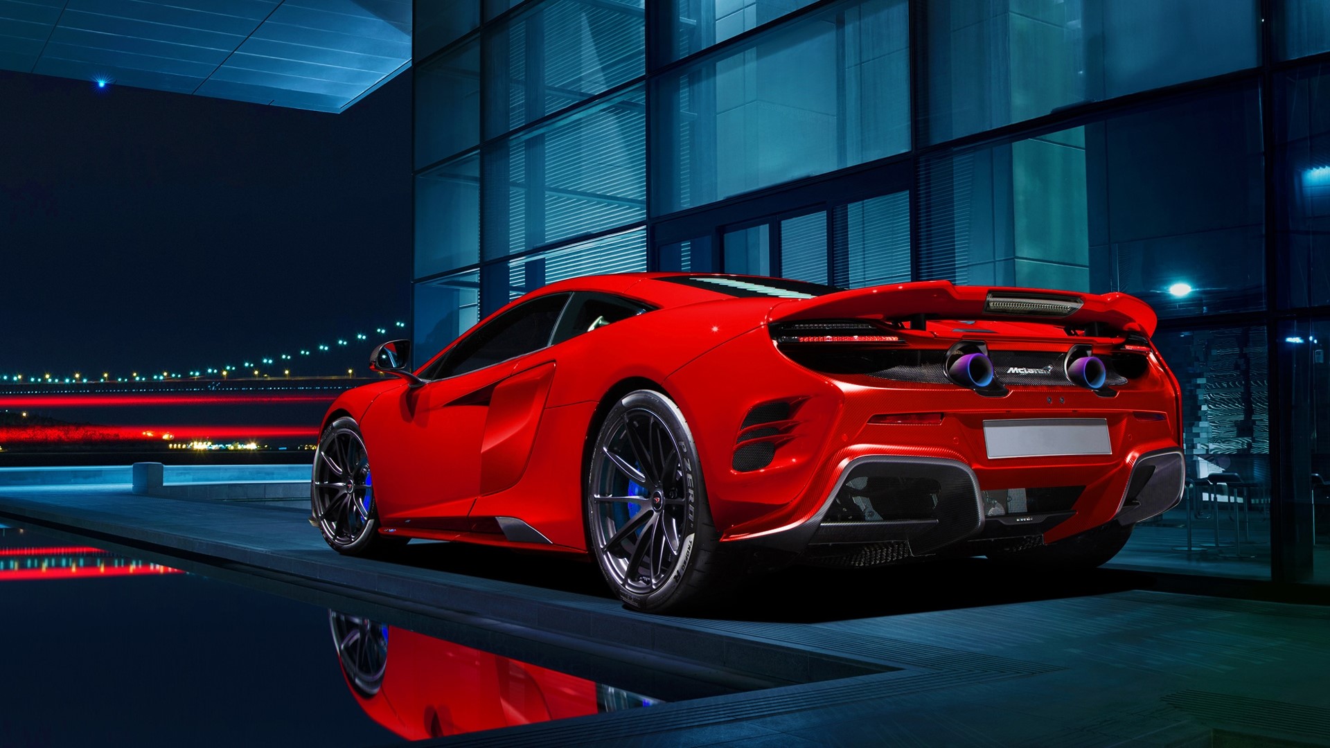 Red McLaren 675 LT parked by a modern building at night HD Wallpaper