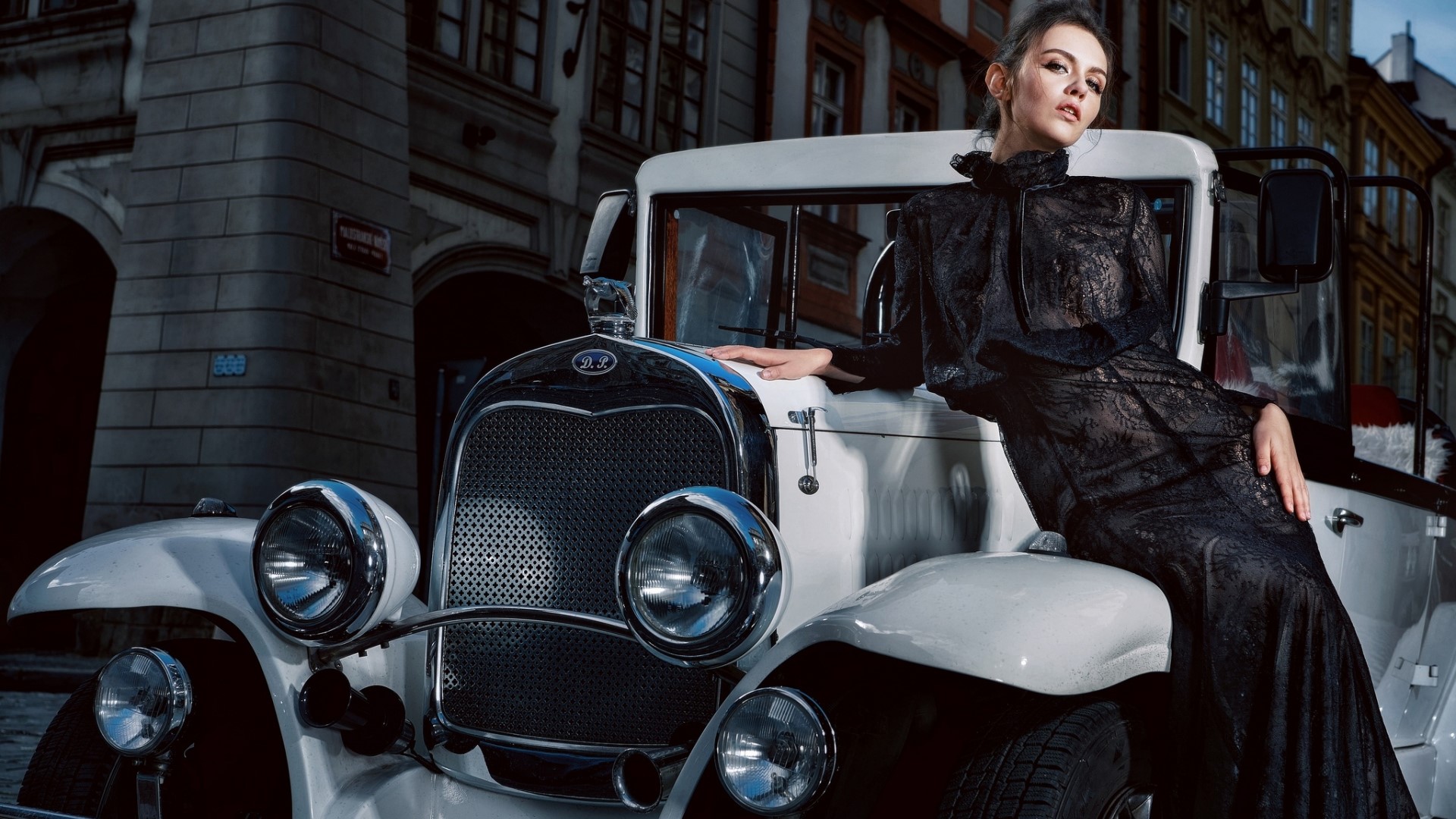 Woman in black dress leaning on vintage car HD Wallpaper