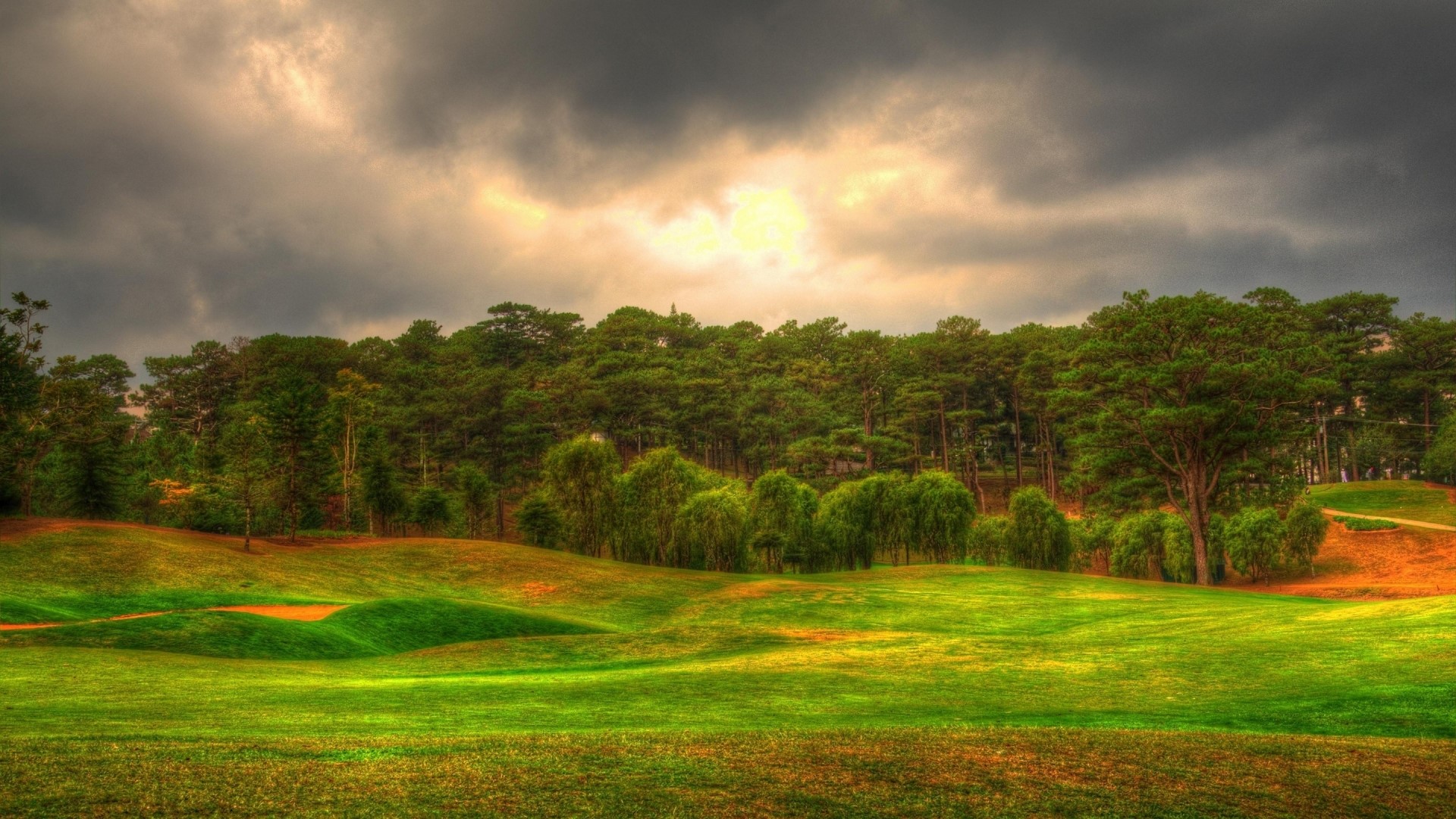 Golf Course with Forest and Cloudy Sky HD Wallpaper