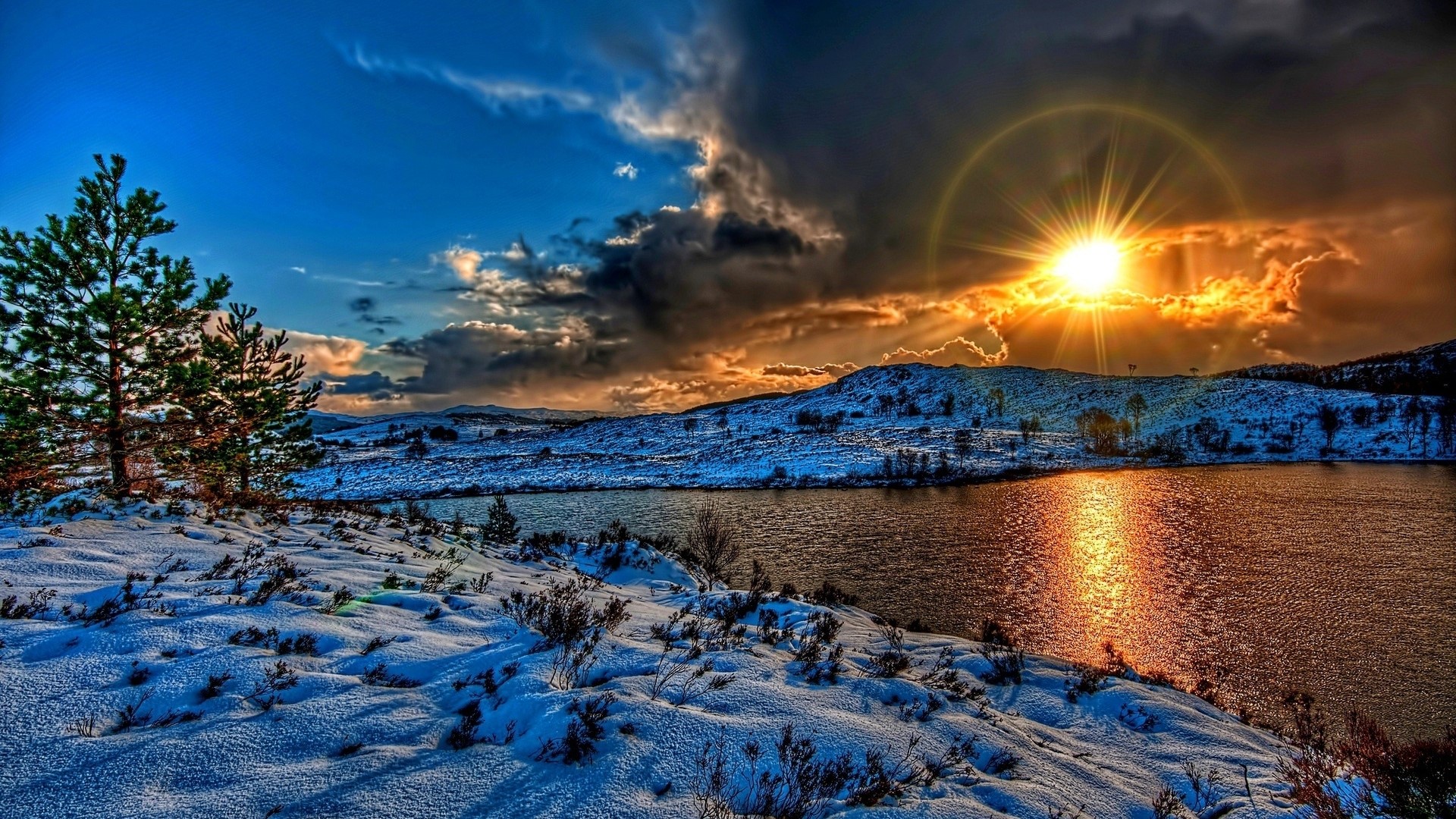Sunset over a snow-covered lake and hills HD Wallpaper