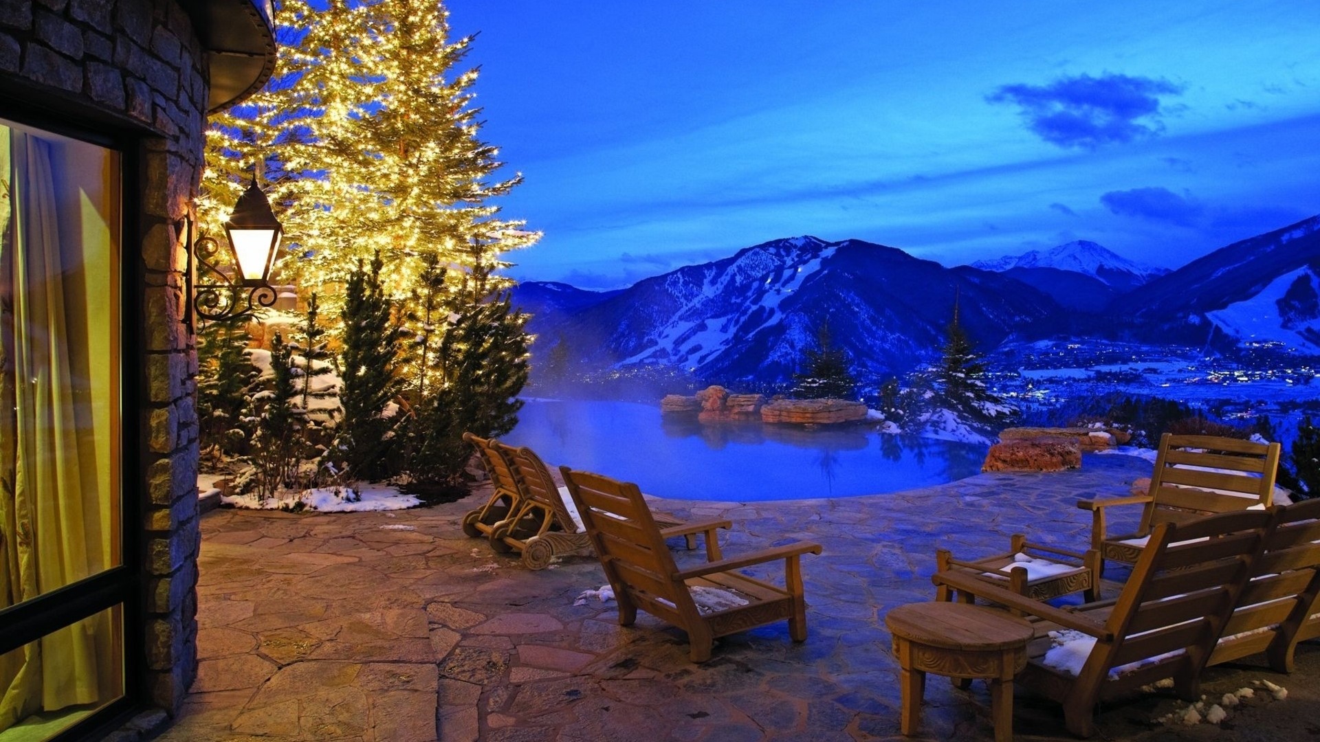 Mountain resort with hot tub and Christmas lights HD Wallpaper