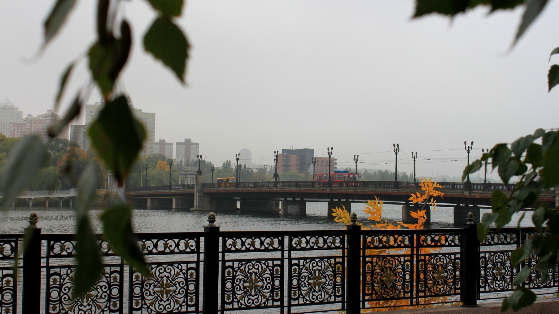 Bridge over river with buildings and trees in Donetsk HD Wallpaper