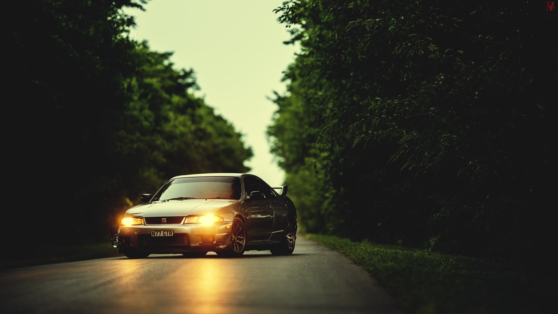 Nissan Skyline GT-R R33 on a Tree-Lined Road HD Wallpaper