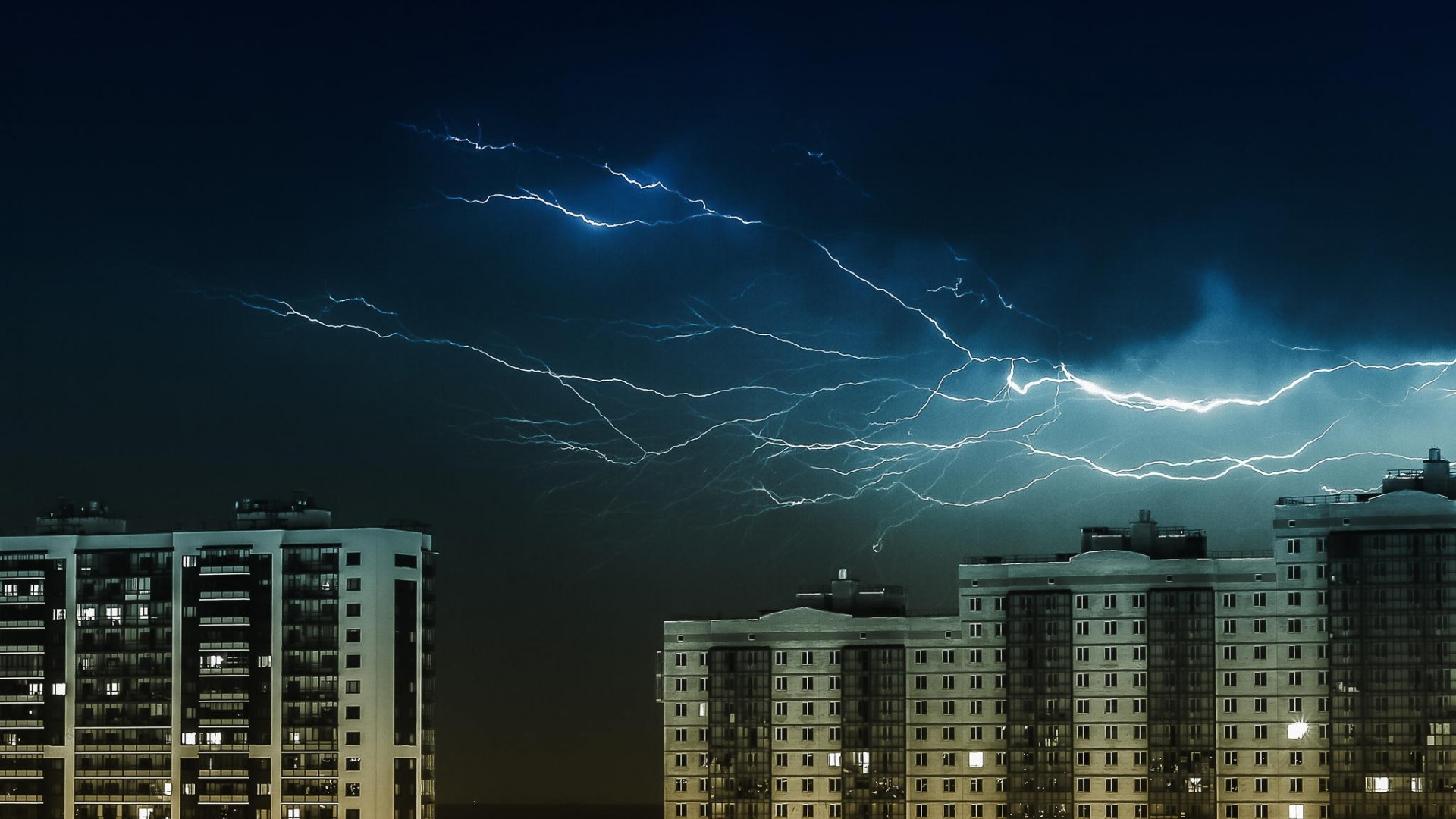 Lightning storm over buildings in Moscow HD Wallpaper