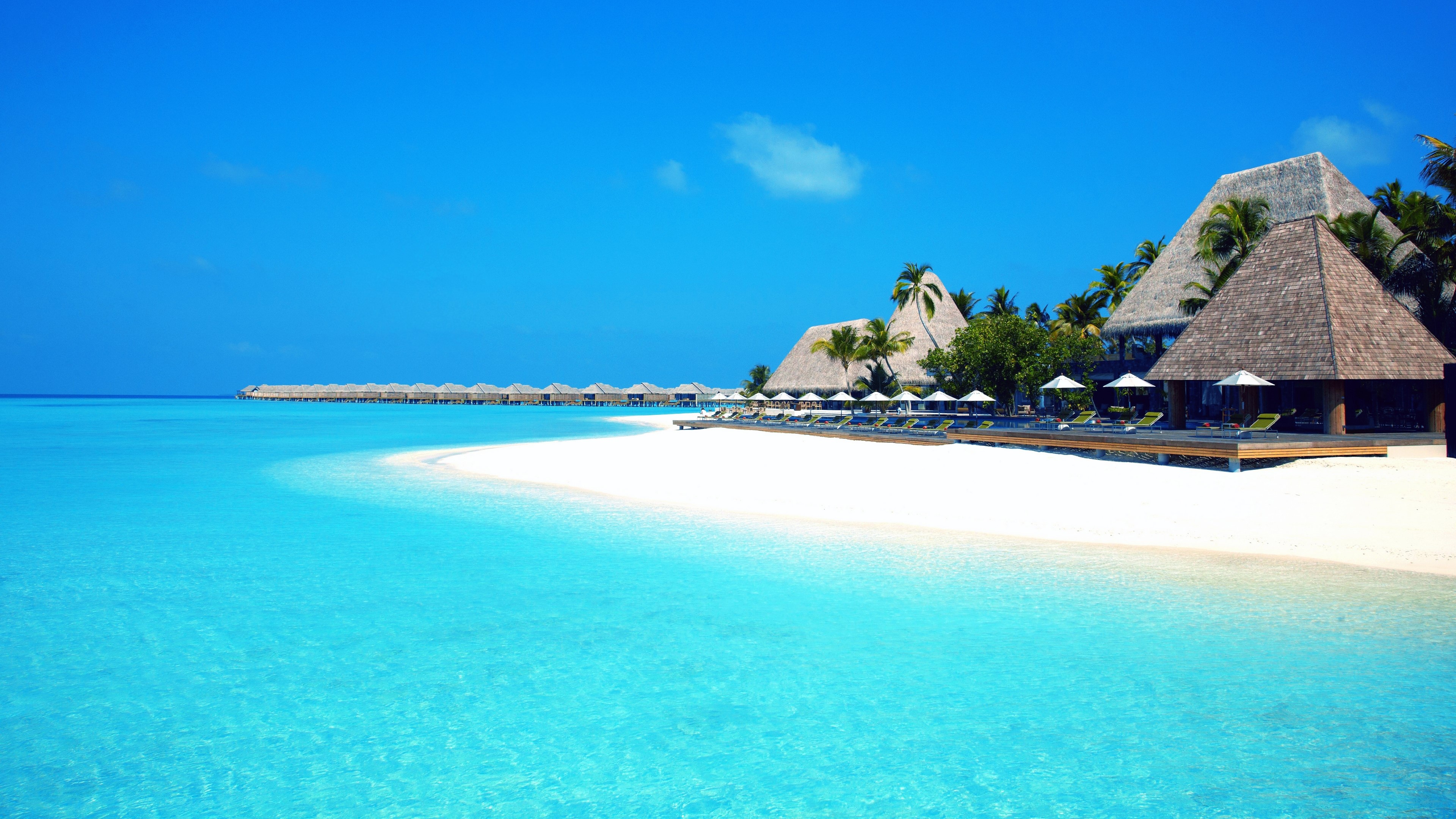 4K Beach with Overwater Bungalows and Resort HD Wallpaper