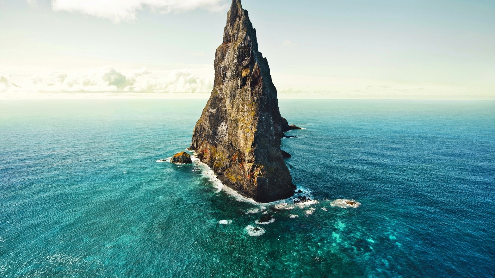 Sea stack in the ocean HD Wallpaper