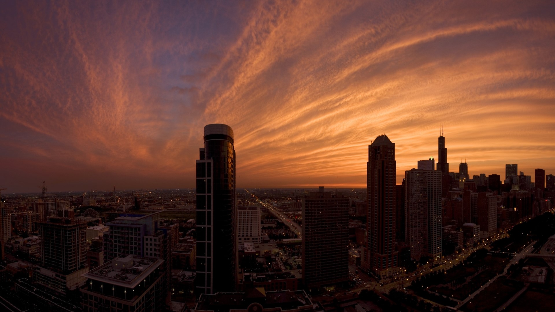 Chicago skyline at sunset with wispy clouds HD Wallpaper