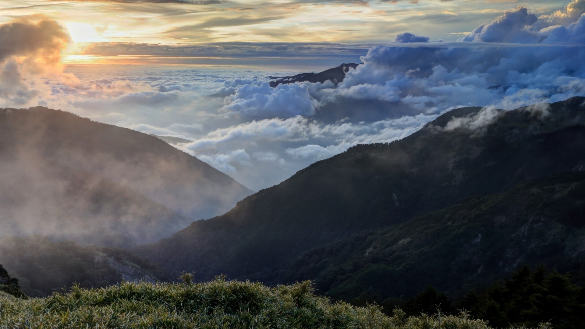 Clouds over mountain landscape at sunset HD Wallpaper