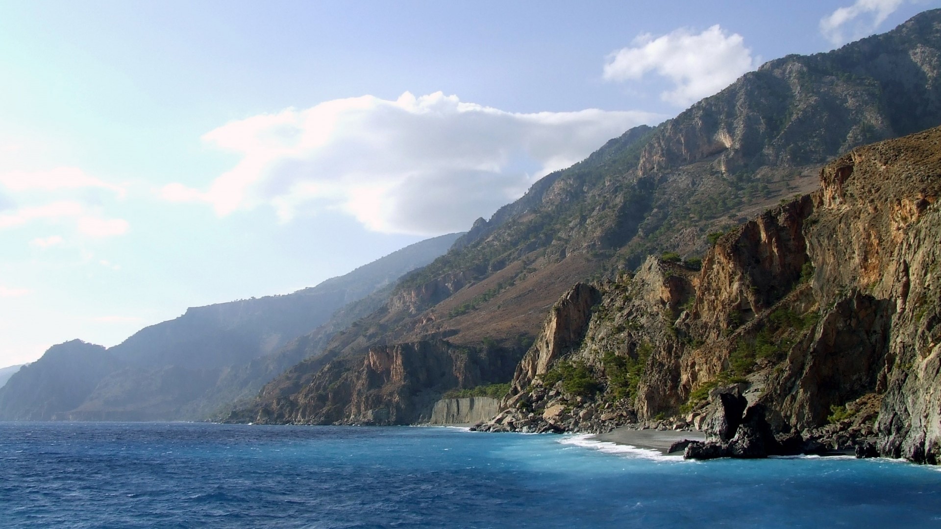 Cliffs of Crete coastline with blue sea HD Wallpaper