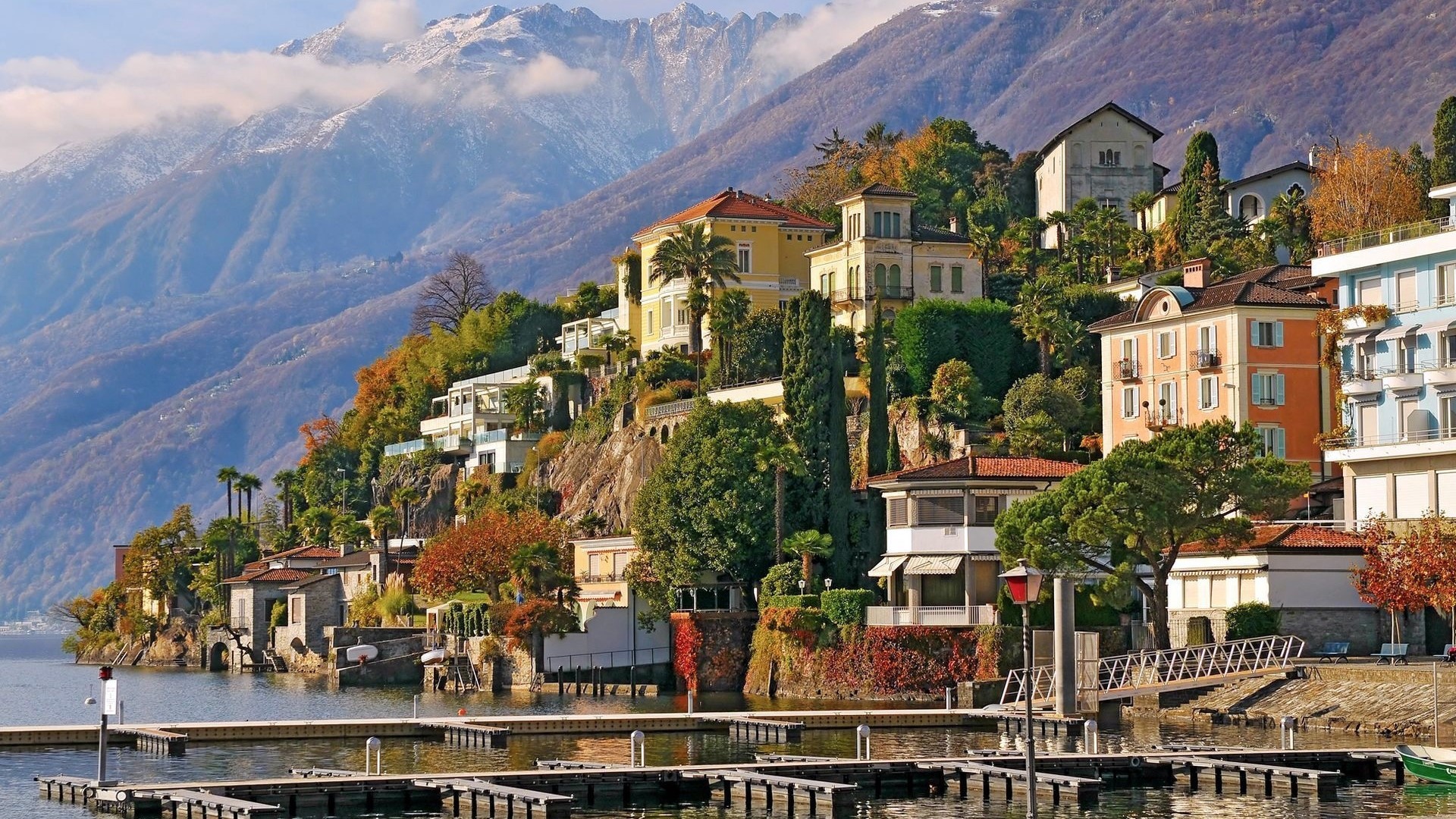 Houses on a hillside overlooking a lake in Ascona, Switzerland HD Wallpaper