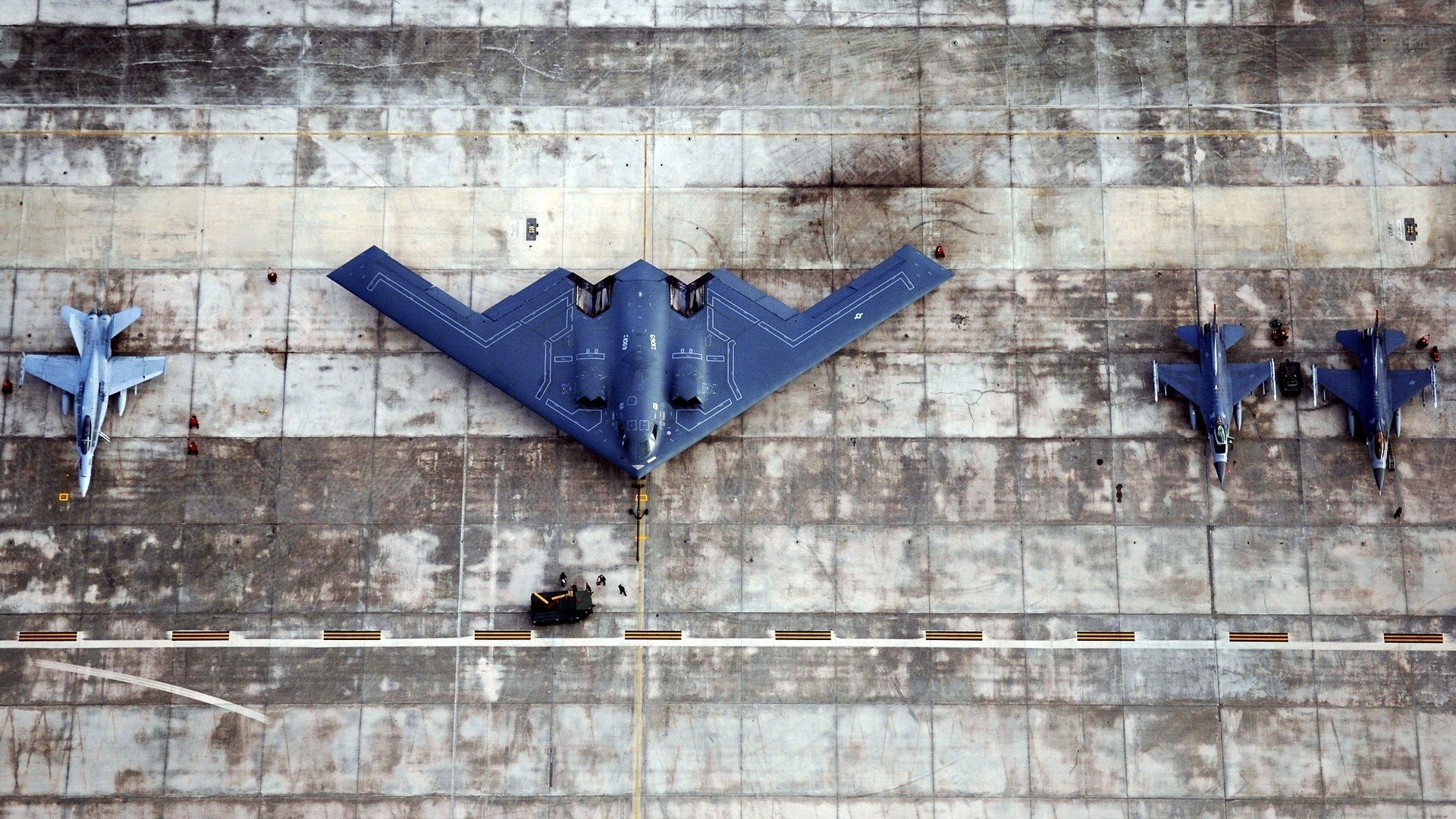 B-2 Spirit Bomber and Fighter Jets on Tarmac HD Wallpaper