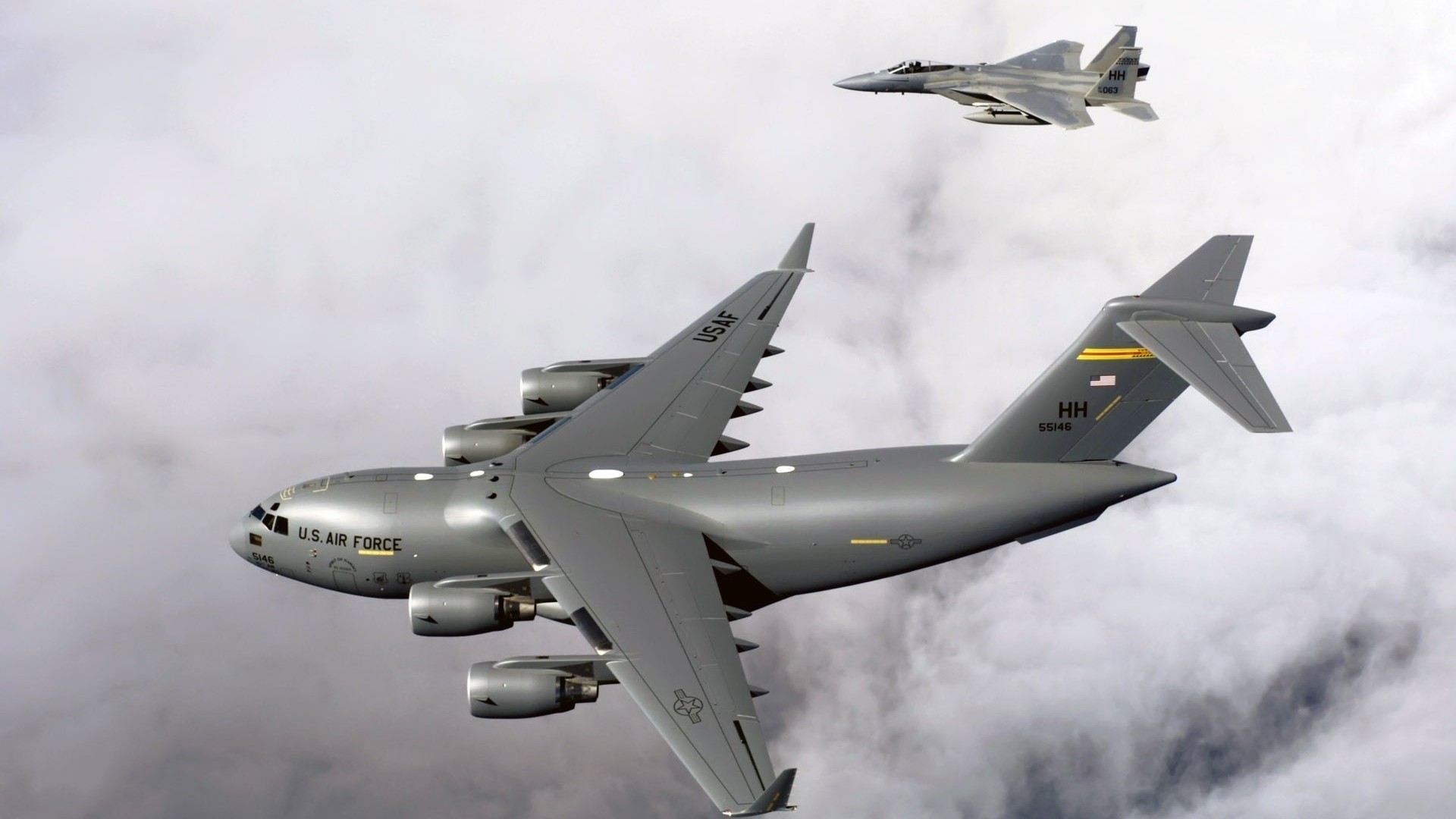 F-15 Eagle and C-17 Globemaster III in flight HD Wallpaper