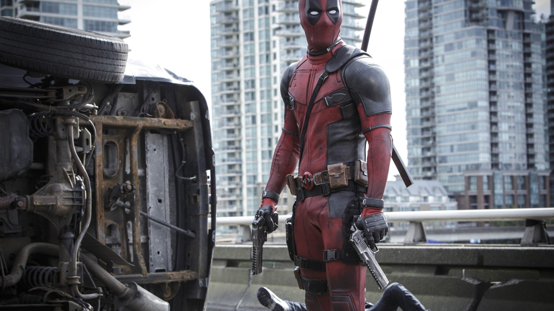 Deadpool with guns and overturned car HD Wallpaper