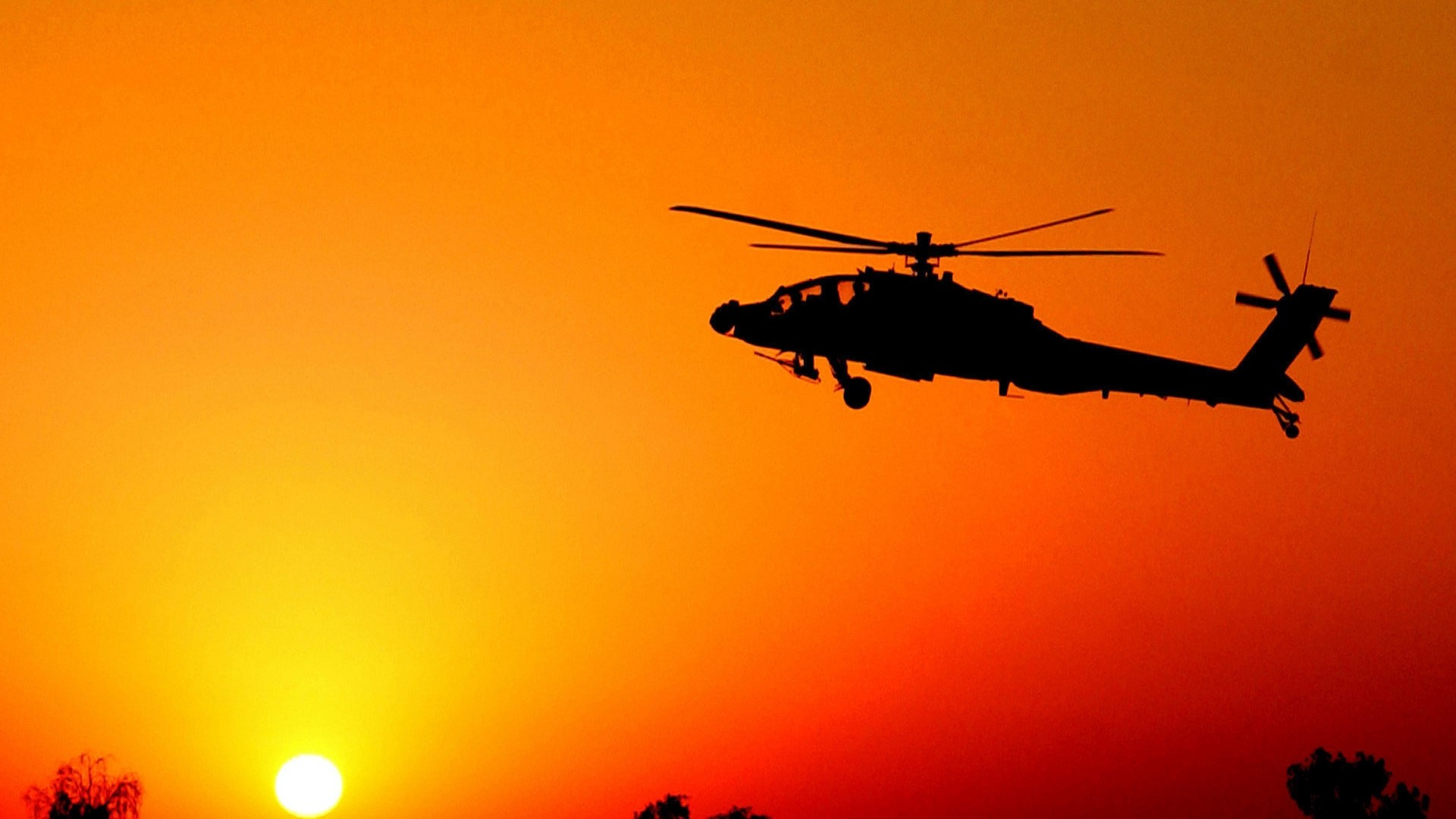 Apache helicopter silhouette against sunset HD Wallpaper