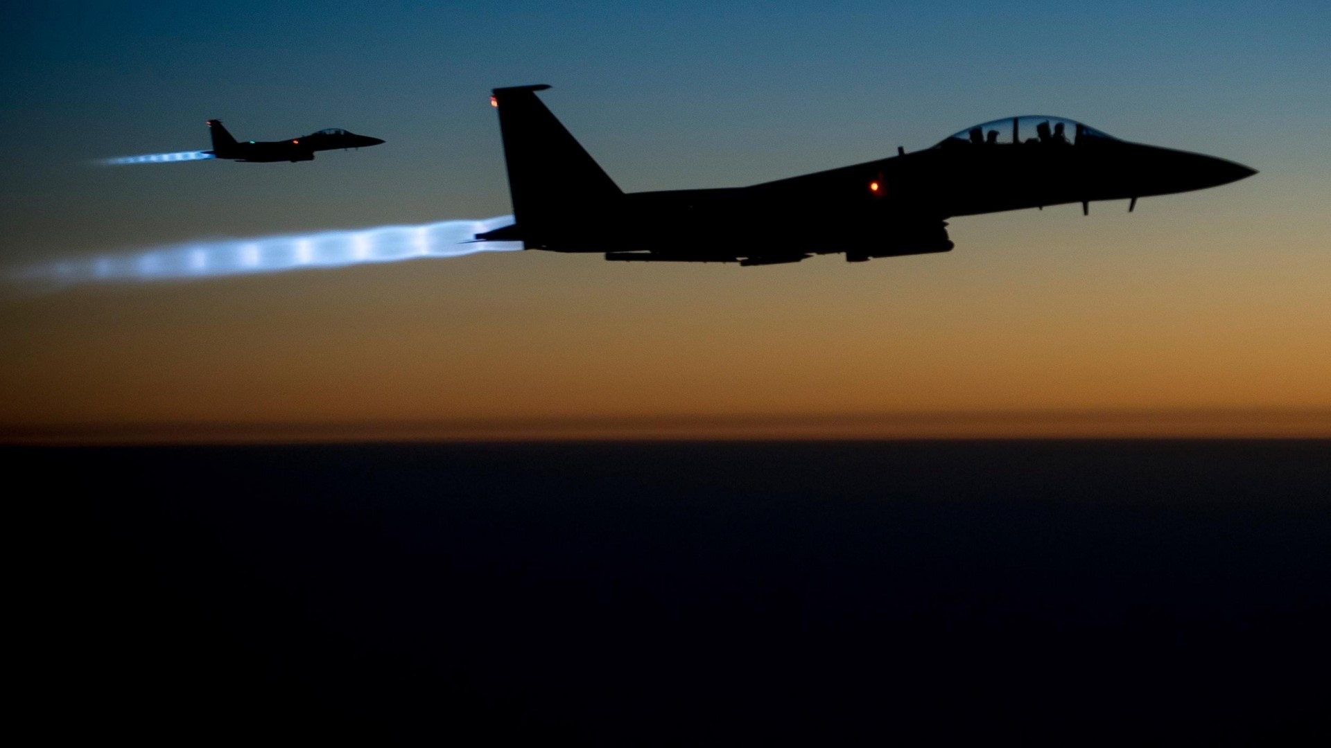 Two F-15 Eagles flying at dusk HD Wallpaper