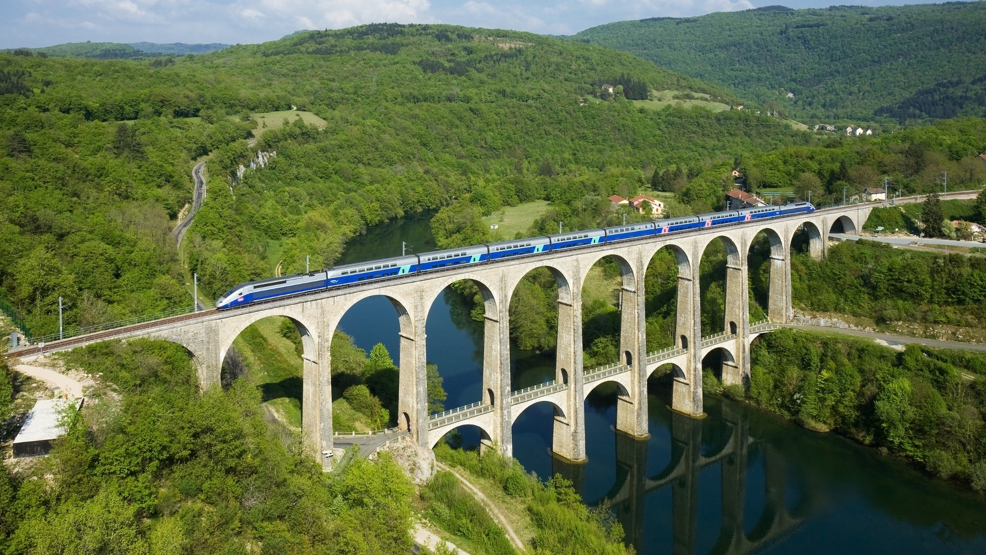 Train crossing the Cize-Bolozon Viaduct over a river HD Wallpaper