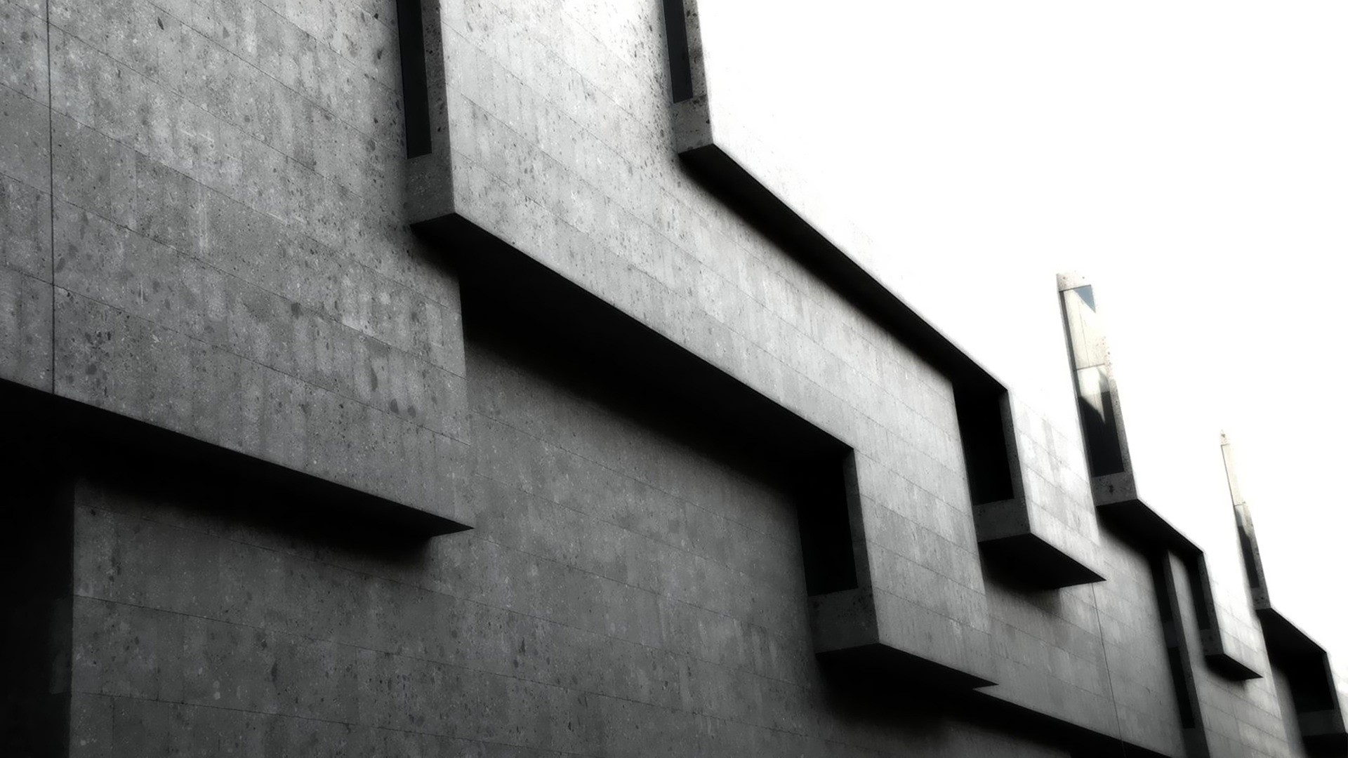 Black and white concrete architecture with geometric patterns HD Wallpaper