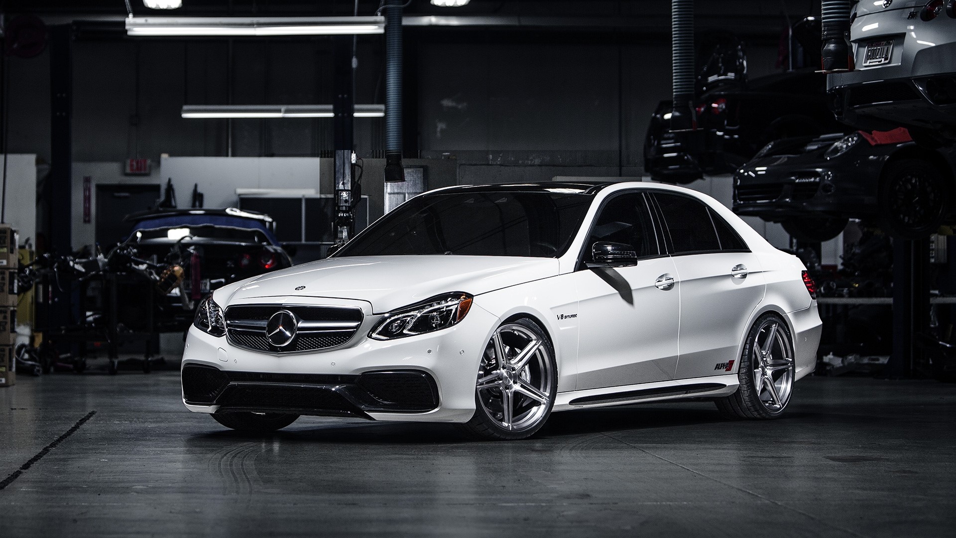 White Mercedes-Benz E63 AMG in a garage HD Wallpaper