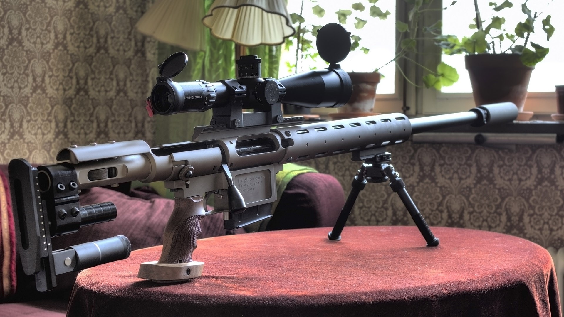 Sniper rifle with scope and bipod on table HD Wallpaper