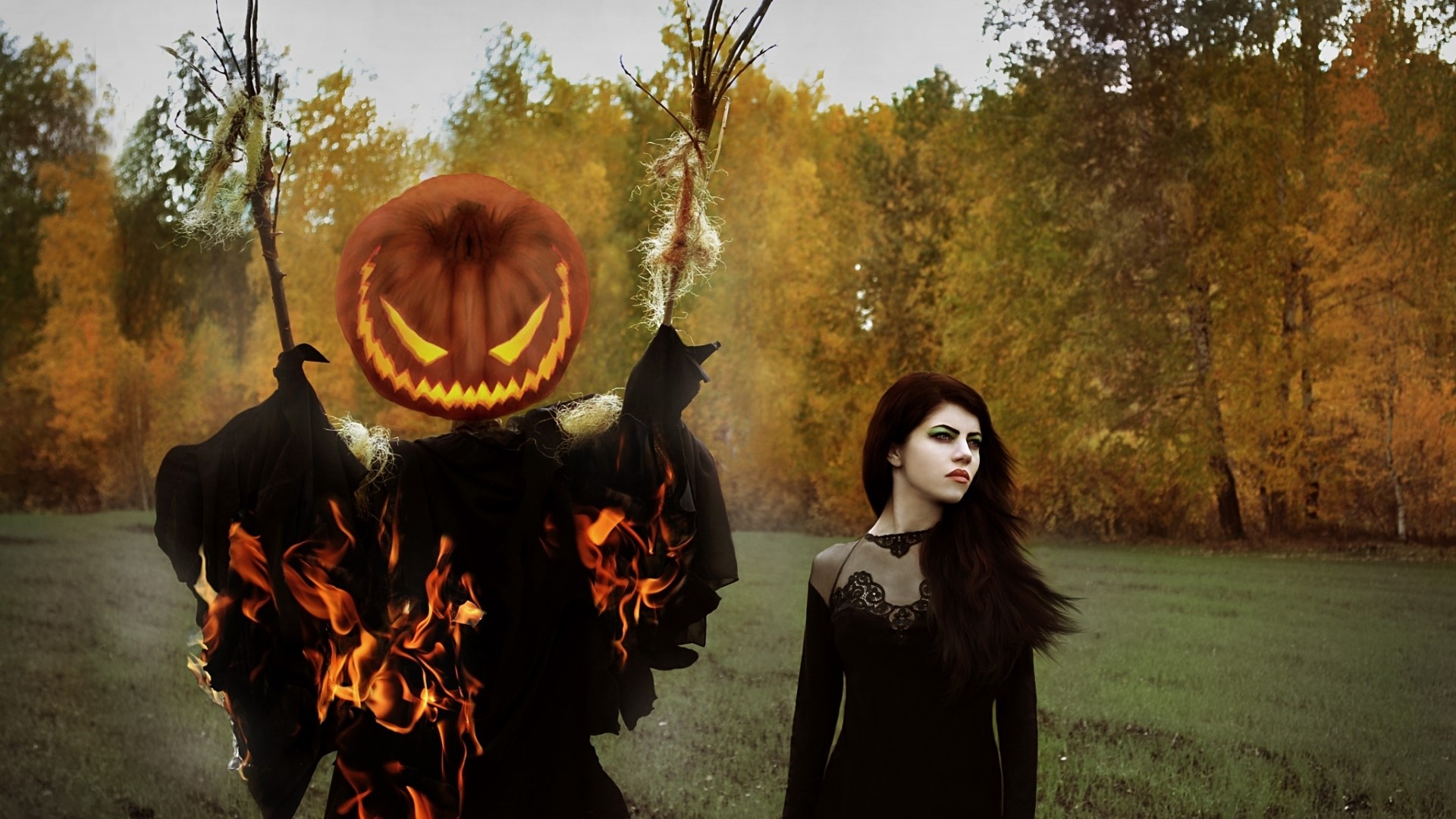Halloween scarecrow on fire with a woman HD Wallpaper